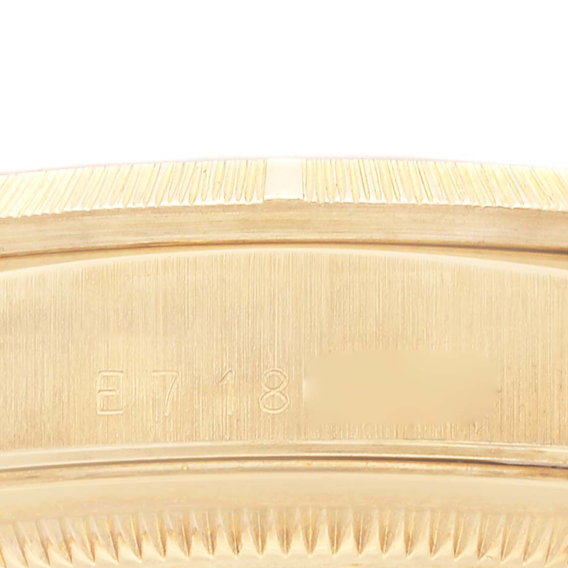 This image shows a close-up of the serial number engraved on the case back of a Rolex President 18248 Men
s Yellow Gold Champagne Dial 18248 Men
s Yellow Gold Champagne Dial model watch.