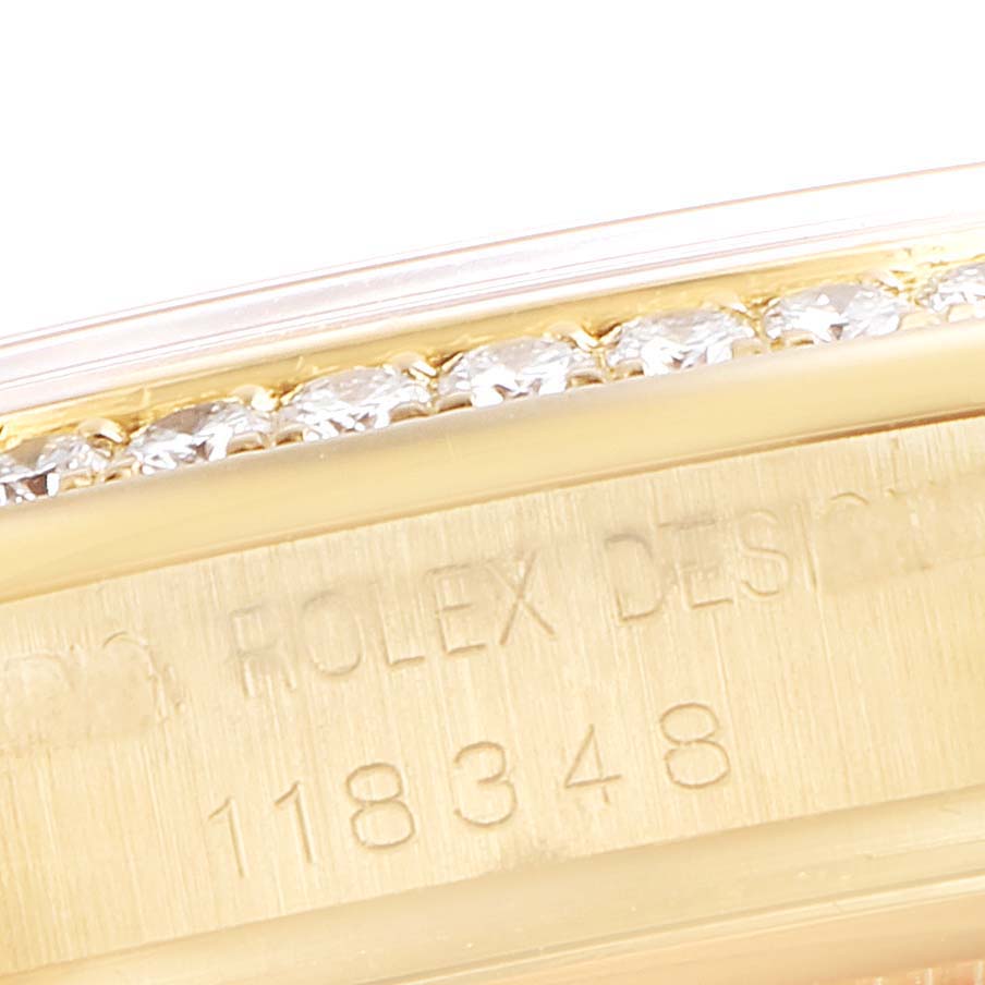The close-up image shows the bezel and model number engravings of a Rolex President 118348 Men
s Yellow Gold Silver Dial 118348 Men
s Yellow Gold Silver Dial watch, including its diamond accents.