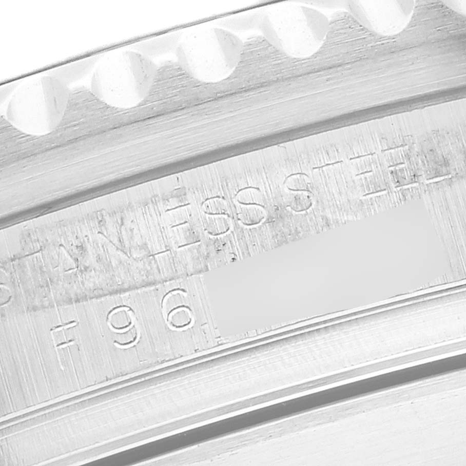 The image shows an angled close-up of the engraved serial and model number of a Rolex Sea-Dweller 16600 Men
s Stainless Steel Black Dial 16600 Men
s Stainless Steel Black Dial watch.