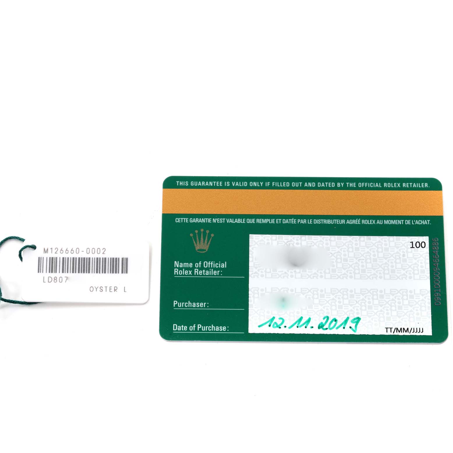 The image shows a green international guarantee card and a hang tag for a Sea-Dweller model by Rolex.