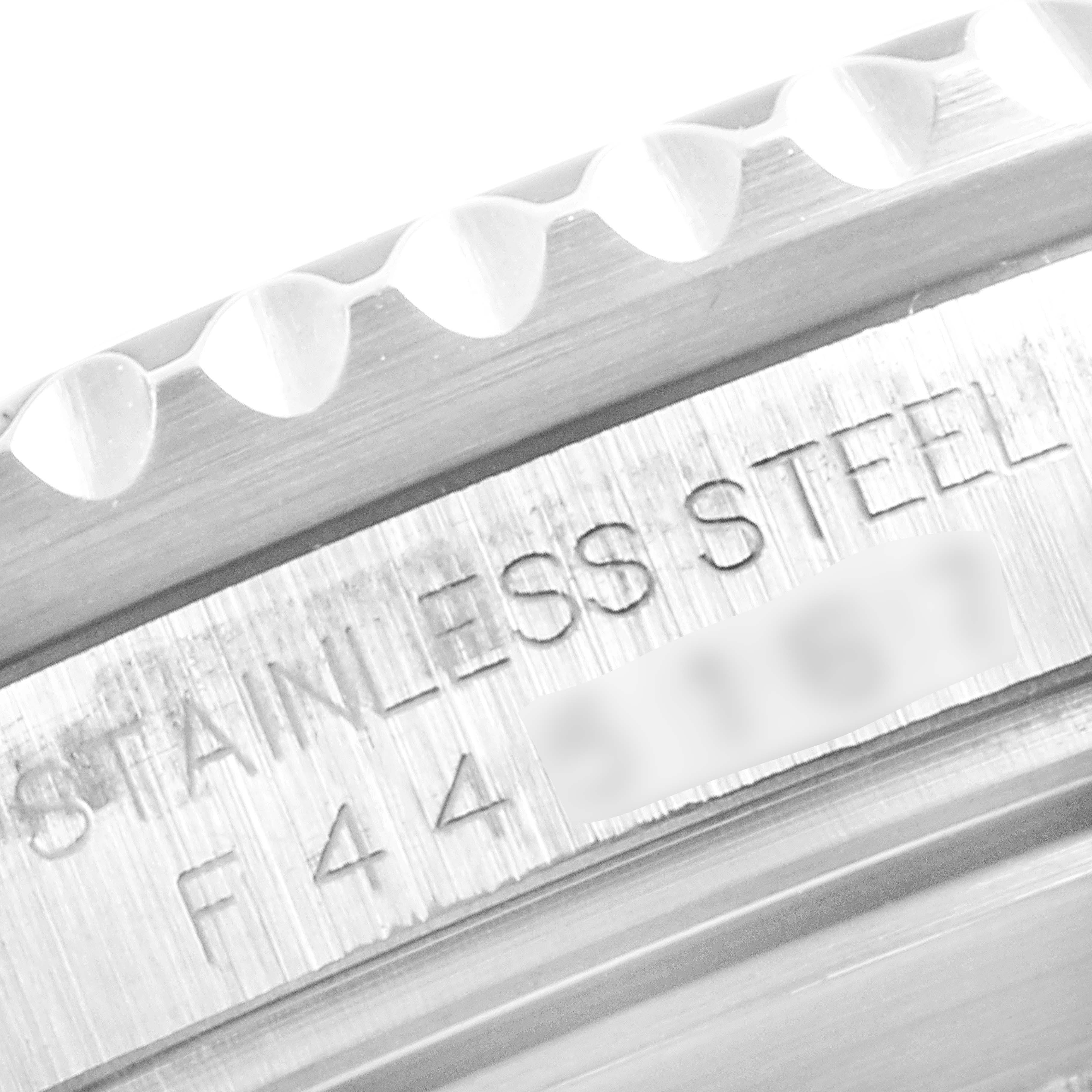 This image shows a close-up of the bezel and the engraved stainless steel inscription on a Rolex Submariner 16610LV Men
s Stainless Steel Black Dial 16610LV Men
s Stainless Steel Black Dial model.