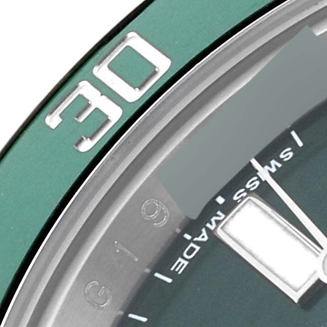 This close-up image shows the bezel and part of the dial of a Rolex Submariner 116610LV Men
s Stainless Steel Green Dial 116610LV Men
s Stainless Steel Green Dial watch.
