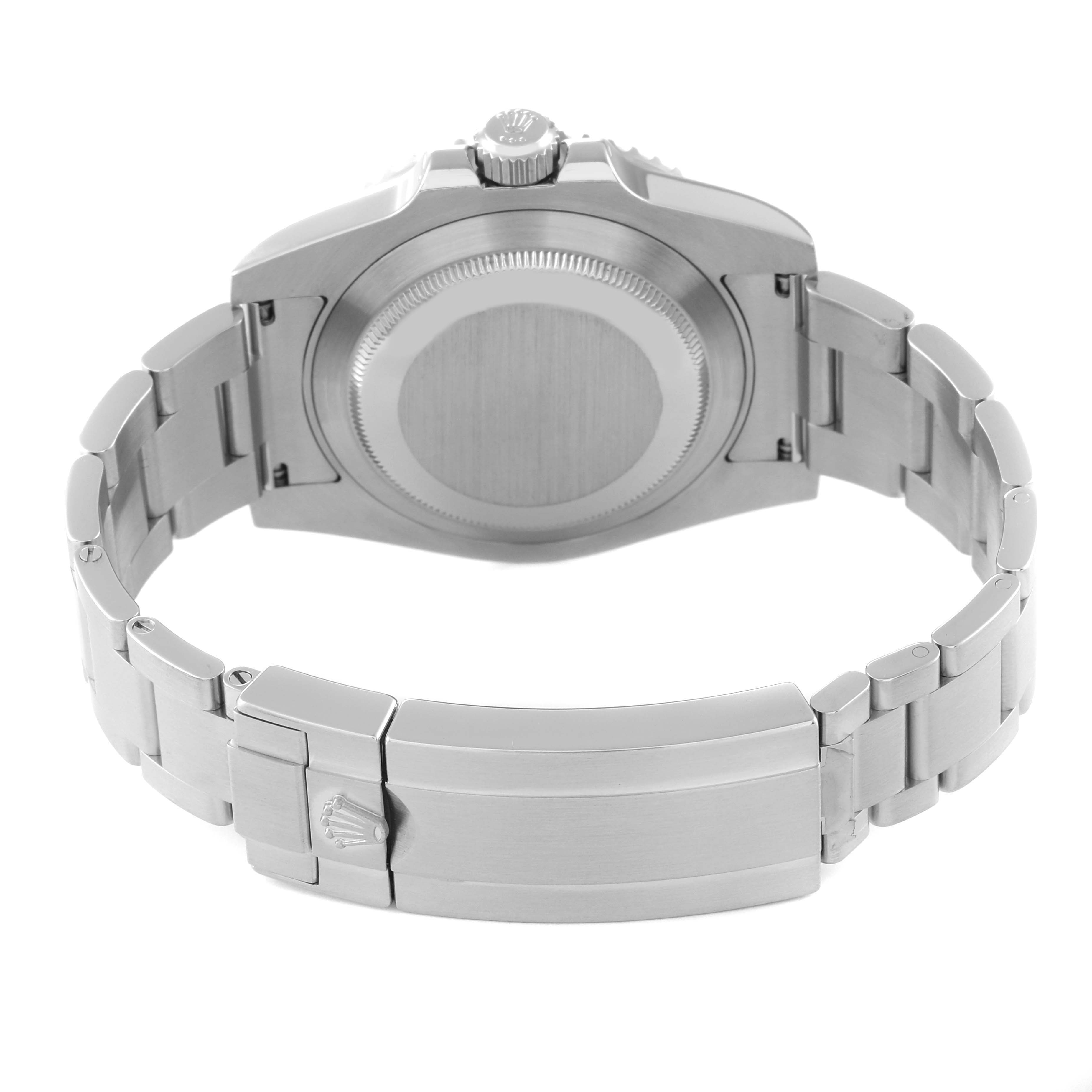 This image shows the underside of a Rolex Submariner 116610LV Men
s Stainless Steel Green Dial 116610LV Men
s Stainless Steel Green Dial watch, highlighting the case back and the metal bracelet clasp.