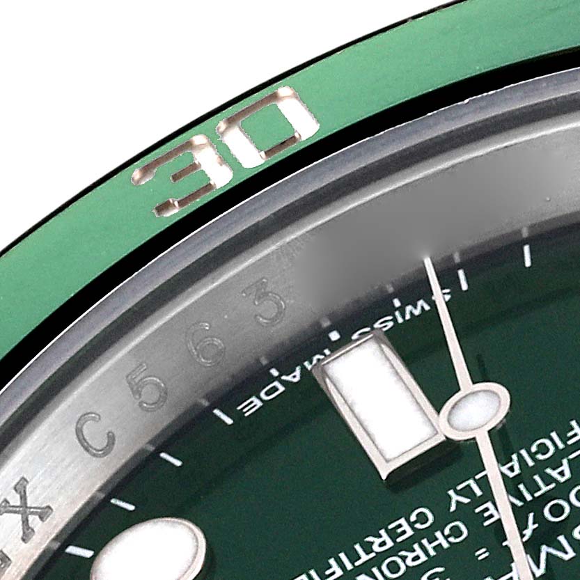 This image shows a close-up of the bezel, dial, and minute hand of a Rolex Submariner 116610LV Men
s Stainless Steel Green Dial 116610LV Men
s Stainless Steel Green Dial watch.
