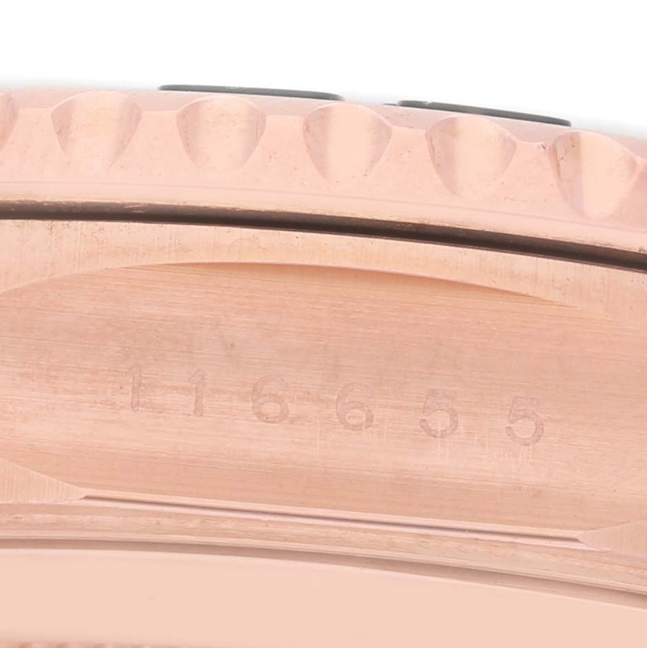 The image shows a close-up of the bezel and the side of the case of a Rolex Yacht-Master 116655 Men's Rose Gold Black Dial watch, highlighting the engravings.