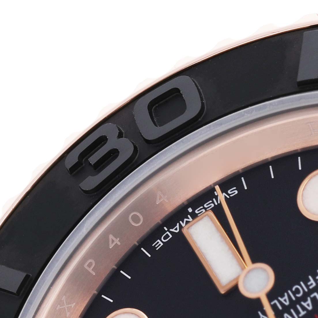 The image shows a close-up of the Rolex Yacht-Master 116655 Men's Rose Gold Black Dial's ceramic bezel and partial dial.
