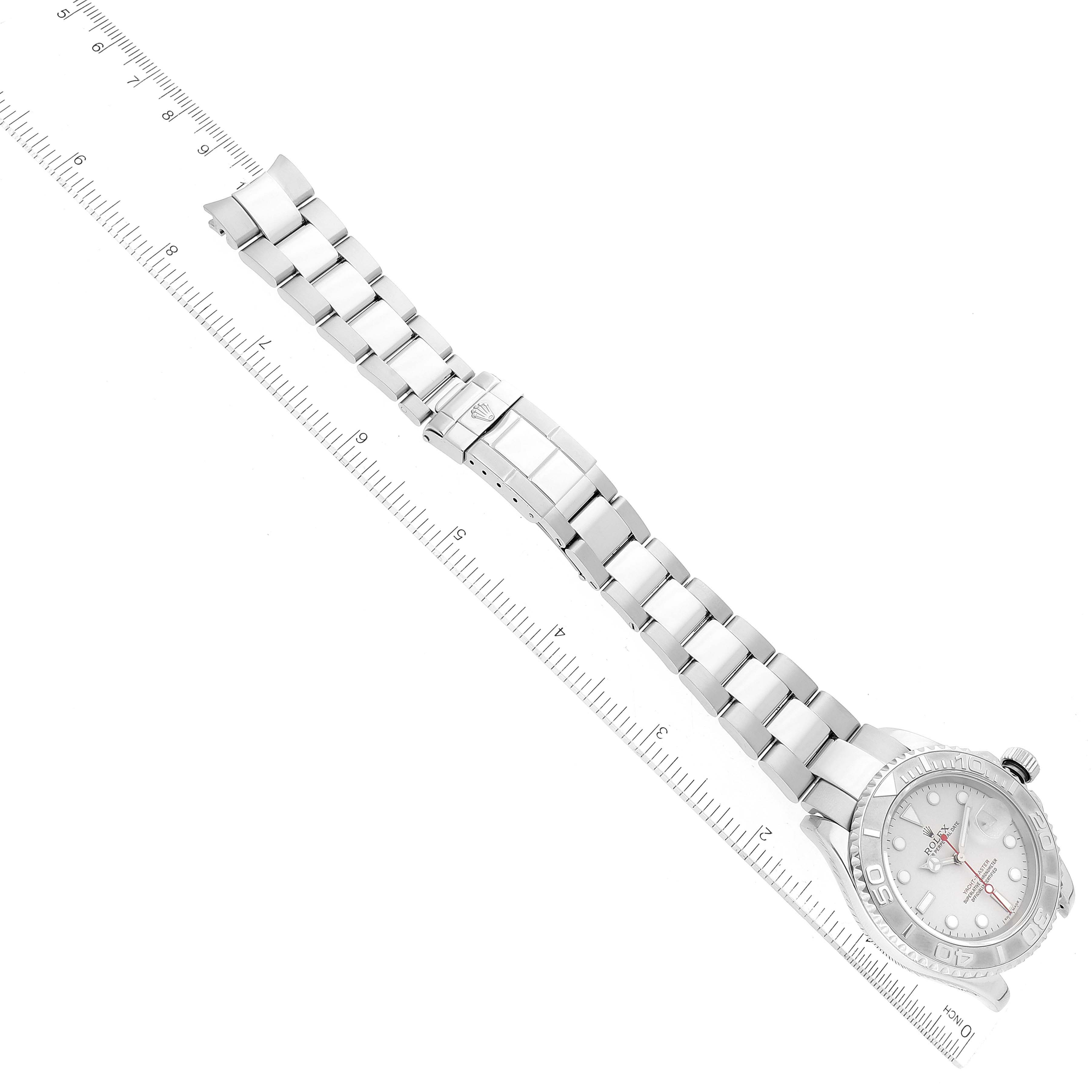 This top-down image shows the bracelet and dial of the Rolex Yacht-Master 16622 Men's Stainless Steel Silver Dial 16622 Men's Stainless Steel Silver Dial watch, positioned against a ruler for scale.