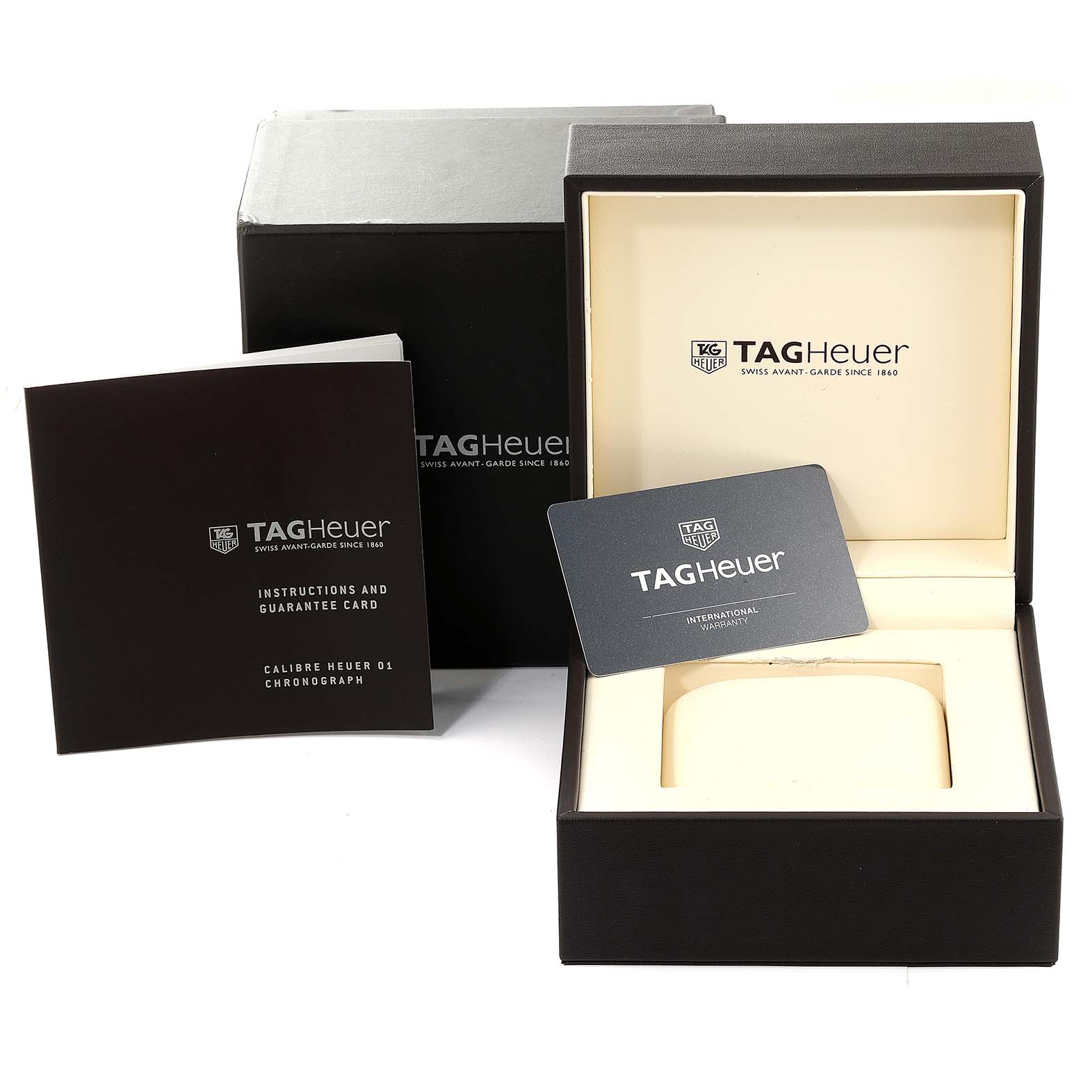 The image shows an open Tag Heuer Carrera CAR2A1H.FT6101 Men's Stainless Steel Black Dial CAR2A1H.FT6101 Men's Stainless Steel Black Dial watch box, an international warranty card, and an instruction and guarantee card.