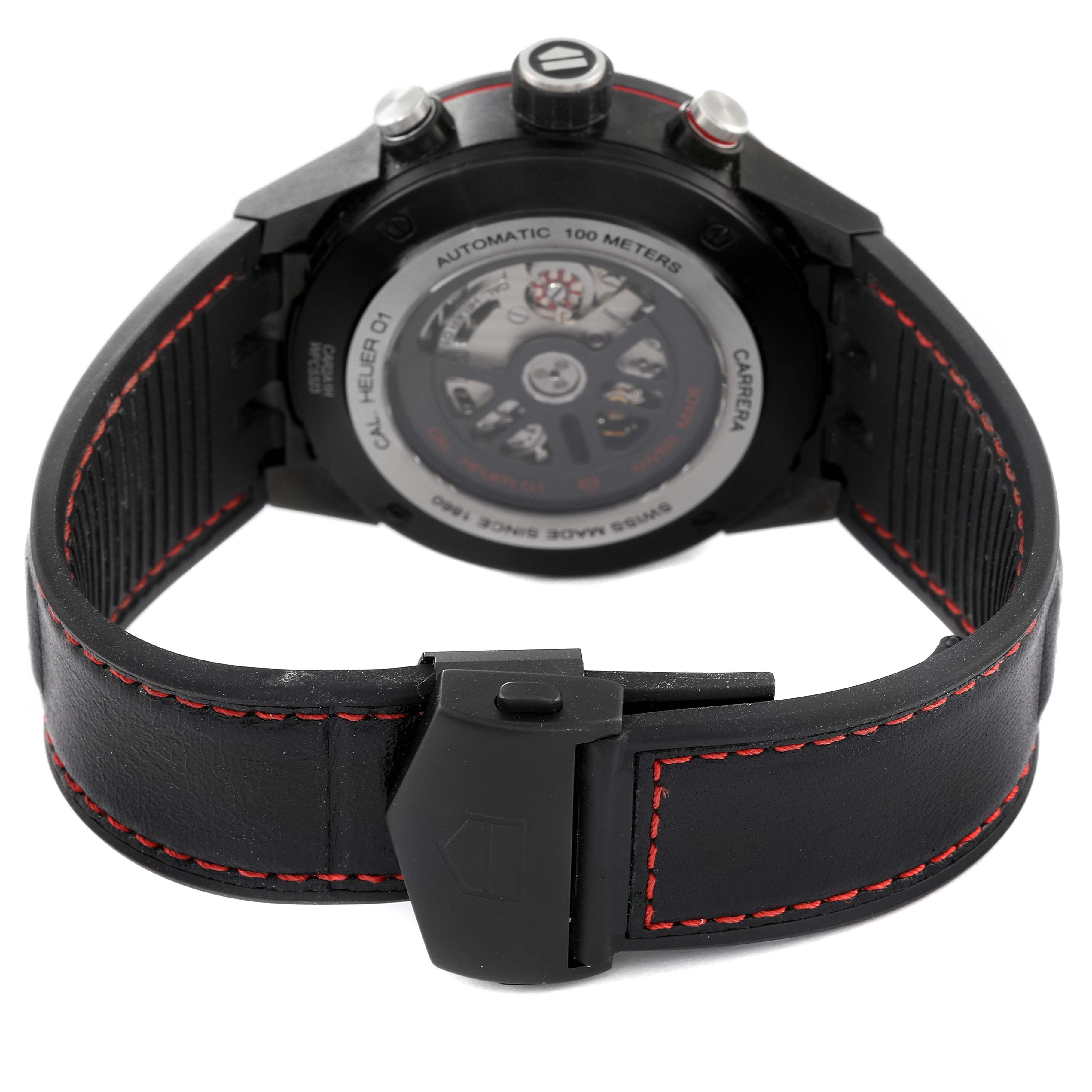 The image shows the back view of a Tag Heuer Carrera CAR2A1H.FT6101 Men's Stainless Steel Black Dial CAR2A1H.FT6101 Men's Stainless Steel Black Dial watch, highlighting its caseback and leather strap with red stitching.