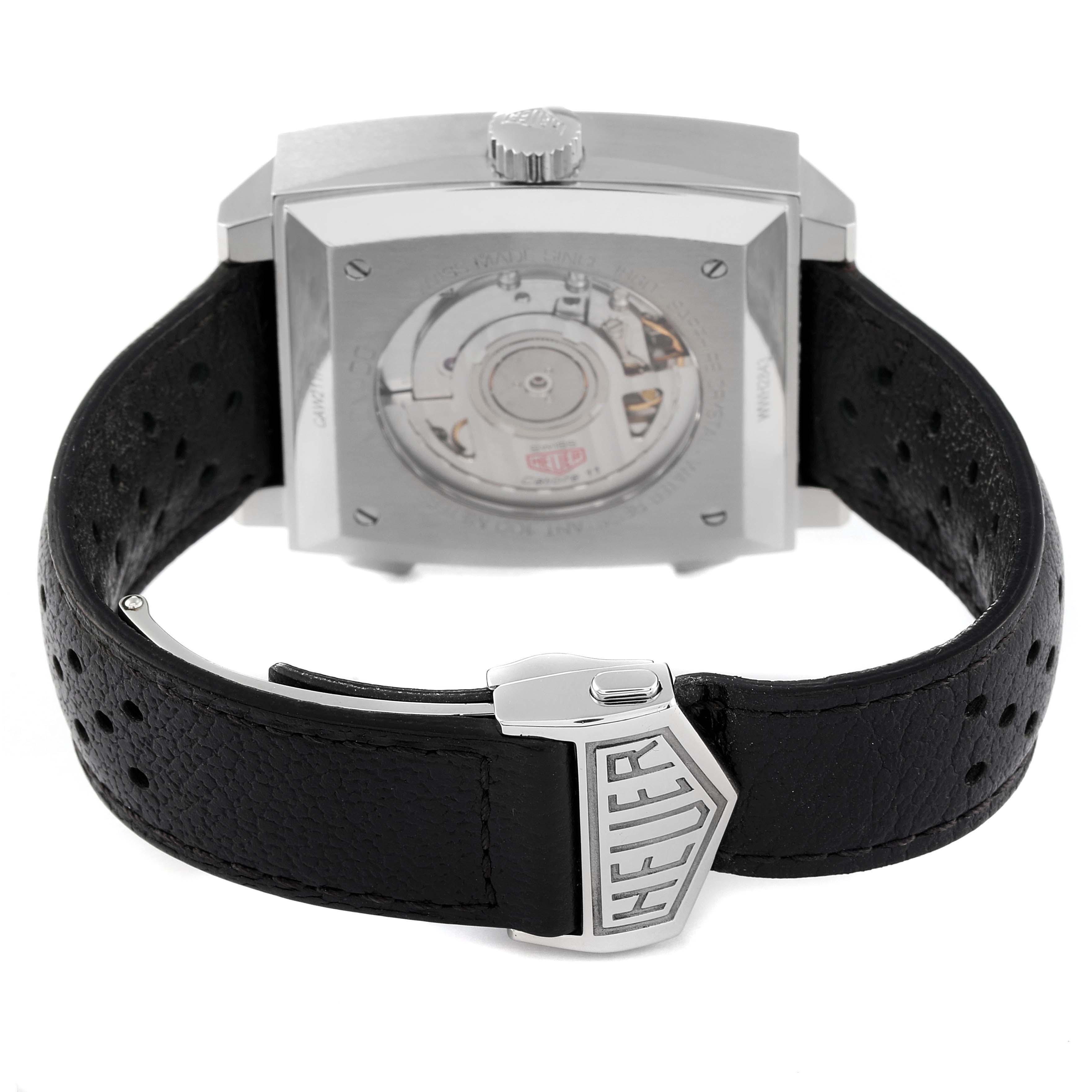 The image shows the back and clasp of the Tag Heuer Monaco CAW211P Men's Stainless Steel Blue Dial CAW211P Men's Stainless Steel Blue Dial watch, highlighting the movement and leather strap.