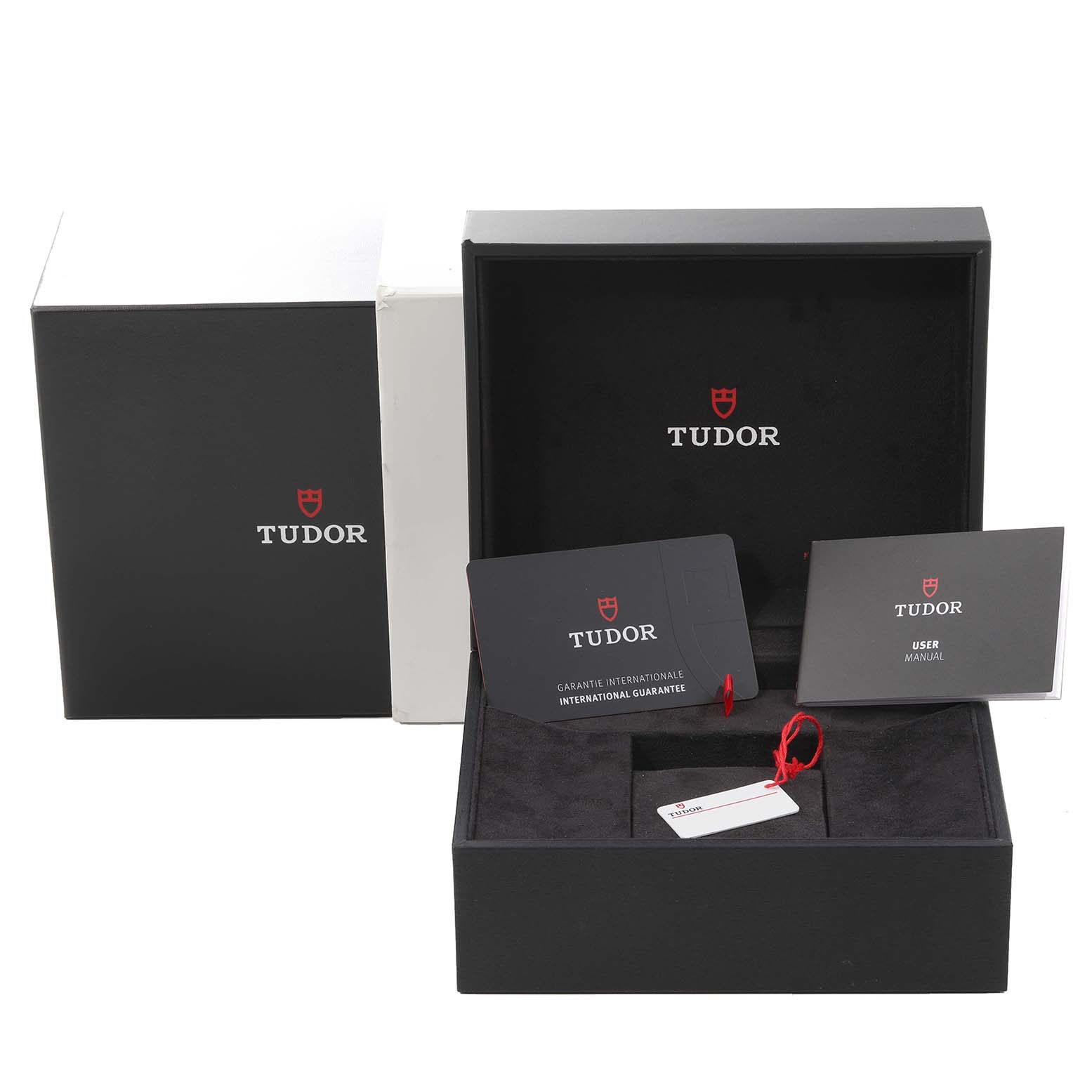 This image shows the packaging, user manual, and guarantee card for the Tudor Heritage Black Bay 79363 Men's Steel and Gold (two tone) Champagne Dial 79363 Men's Steel and Gold (two tone) Champagne Dial watch.