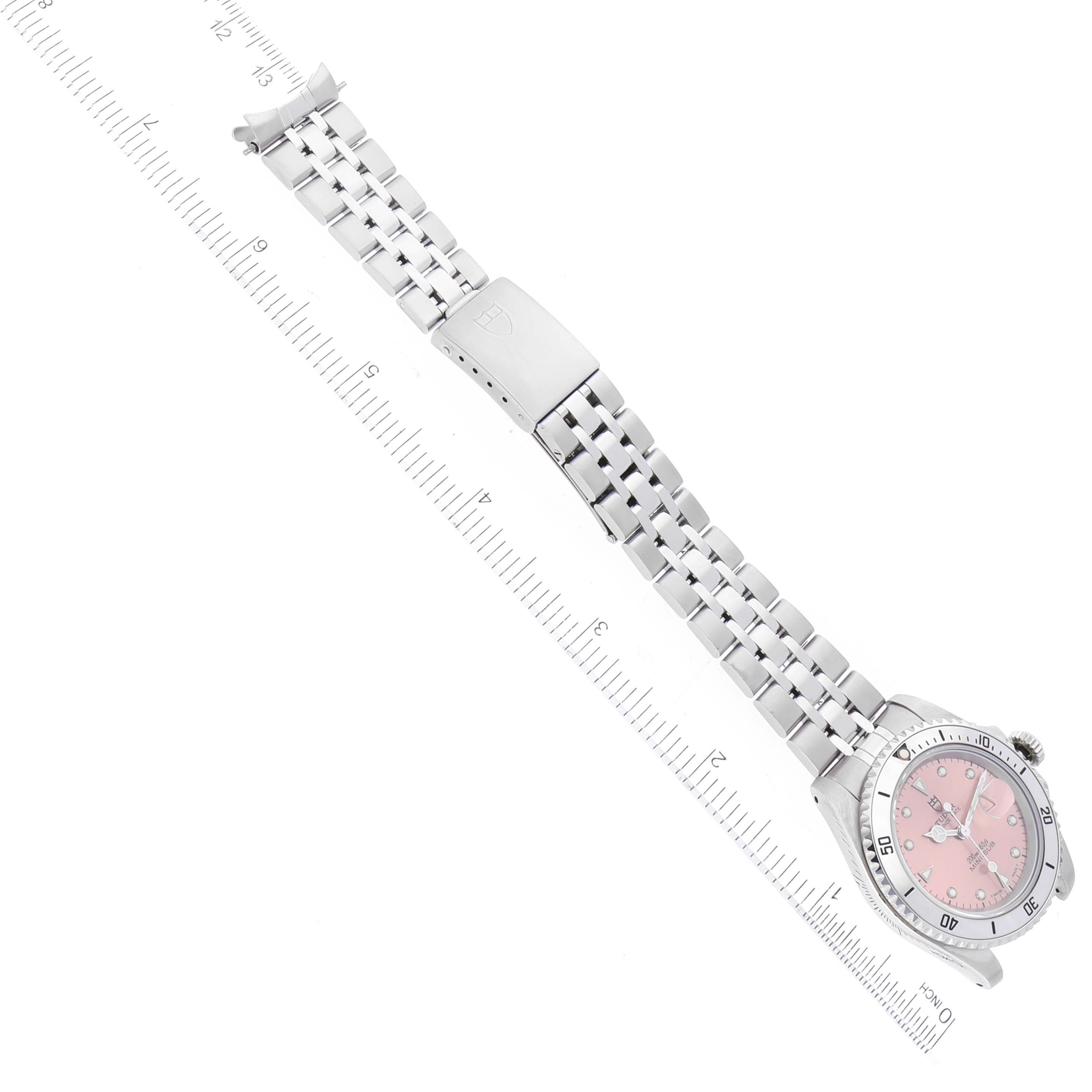 The image shows an overhead view of a Tudor Prince watch with a metal strap, clasp, and a measure ruler for scale.