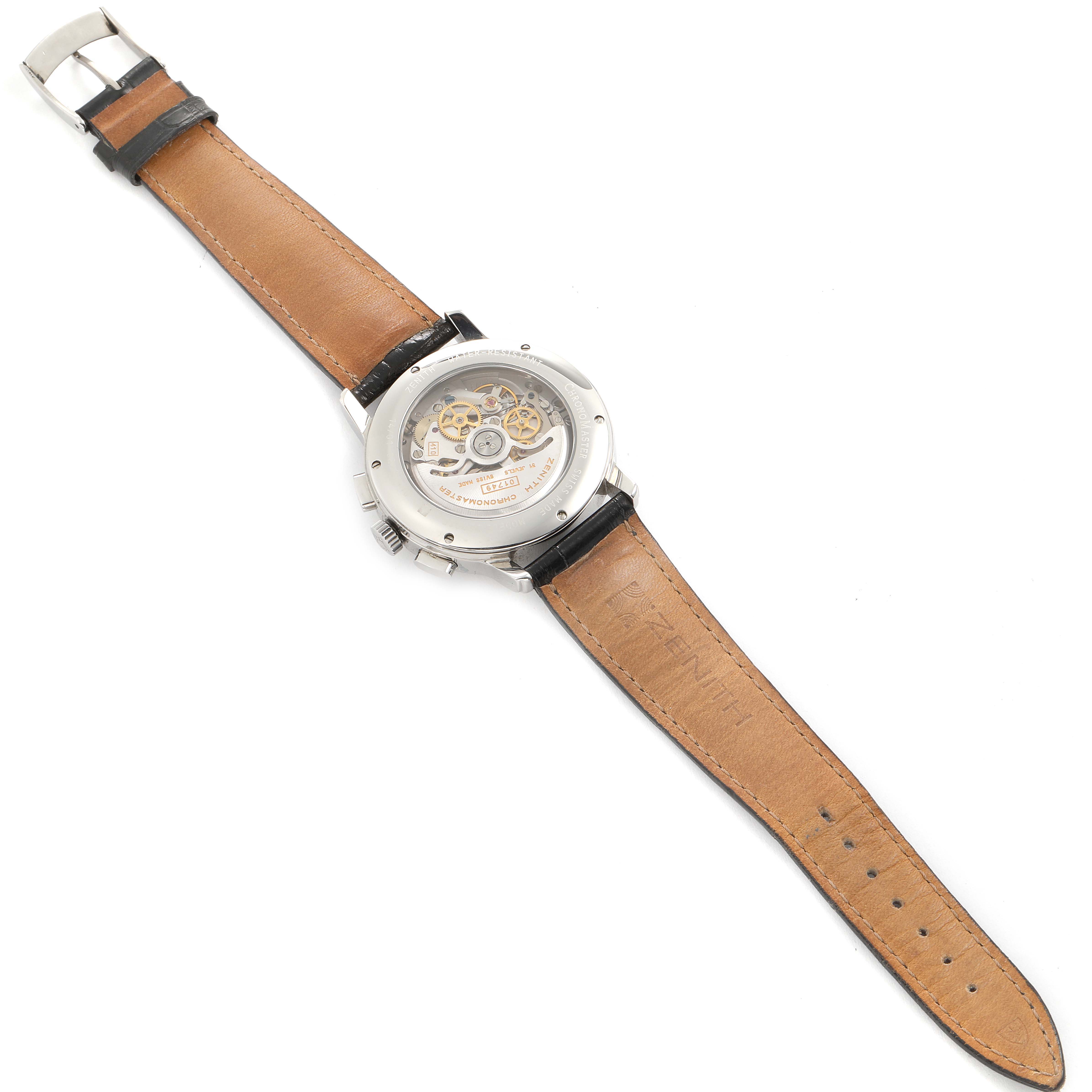 The image shows a Zenith Chronomaster 01.0240.410 Men's Stainless Steel Silver Dial 01.0240.410 Men's Stainless Steel Silver Dial watch from the back, highlighting its leather strap and exposed mechanical movement.