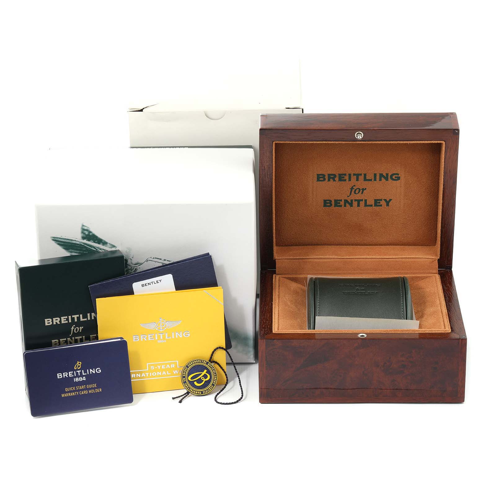 The image shows a Breitling for Bentley watch box, warranty cards, and documents from a front angle.