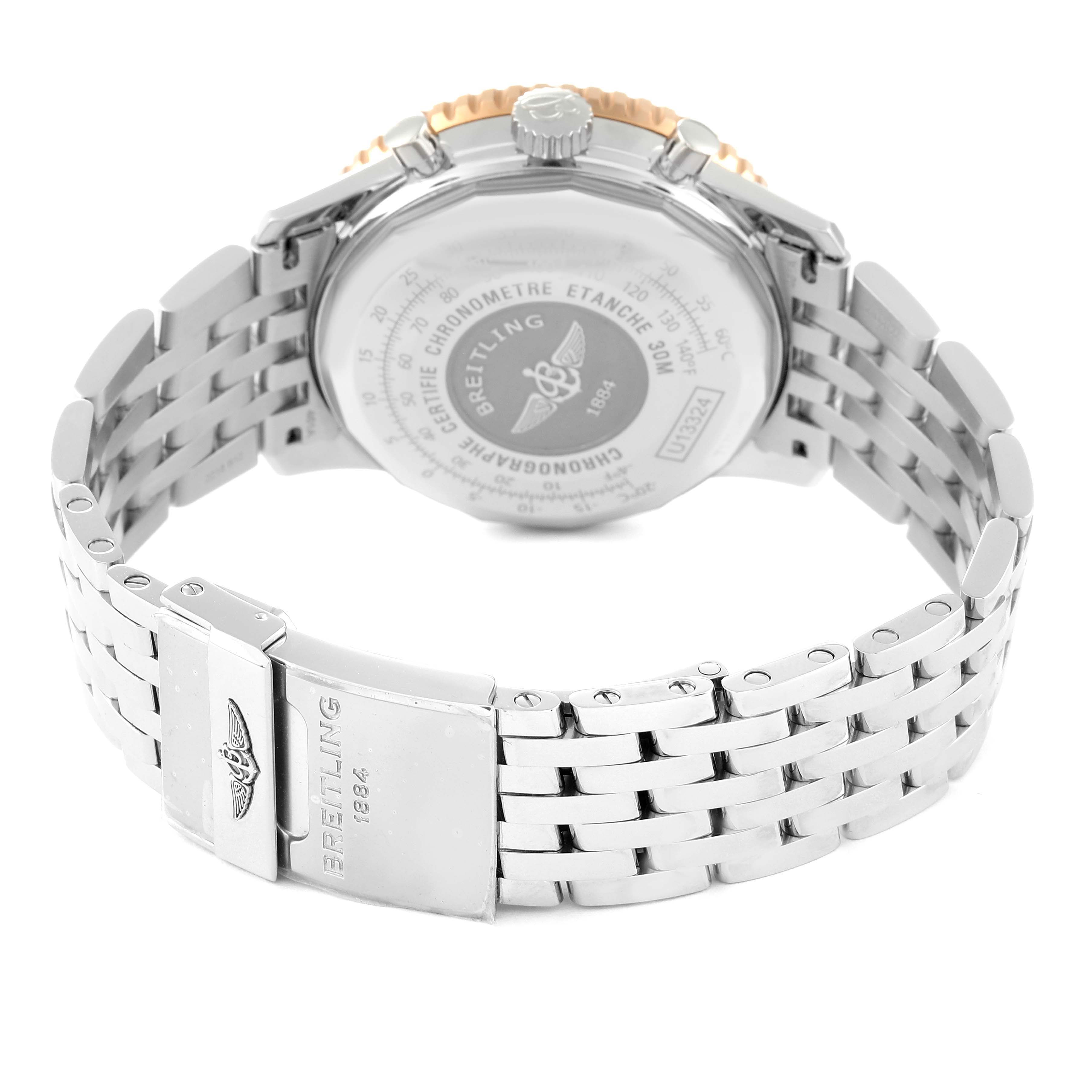 The image shows the back and stainless steel bracelet of a Breitling Navitimer U13324211B1X1 Men
s Steel and Gold (two tone) Black Dial U13324211B1X1 Men
s Steel and Gold (two tone) Black Dial watch from an angled rear view.