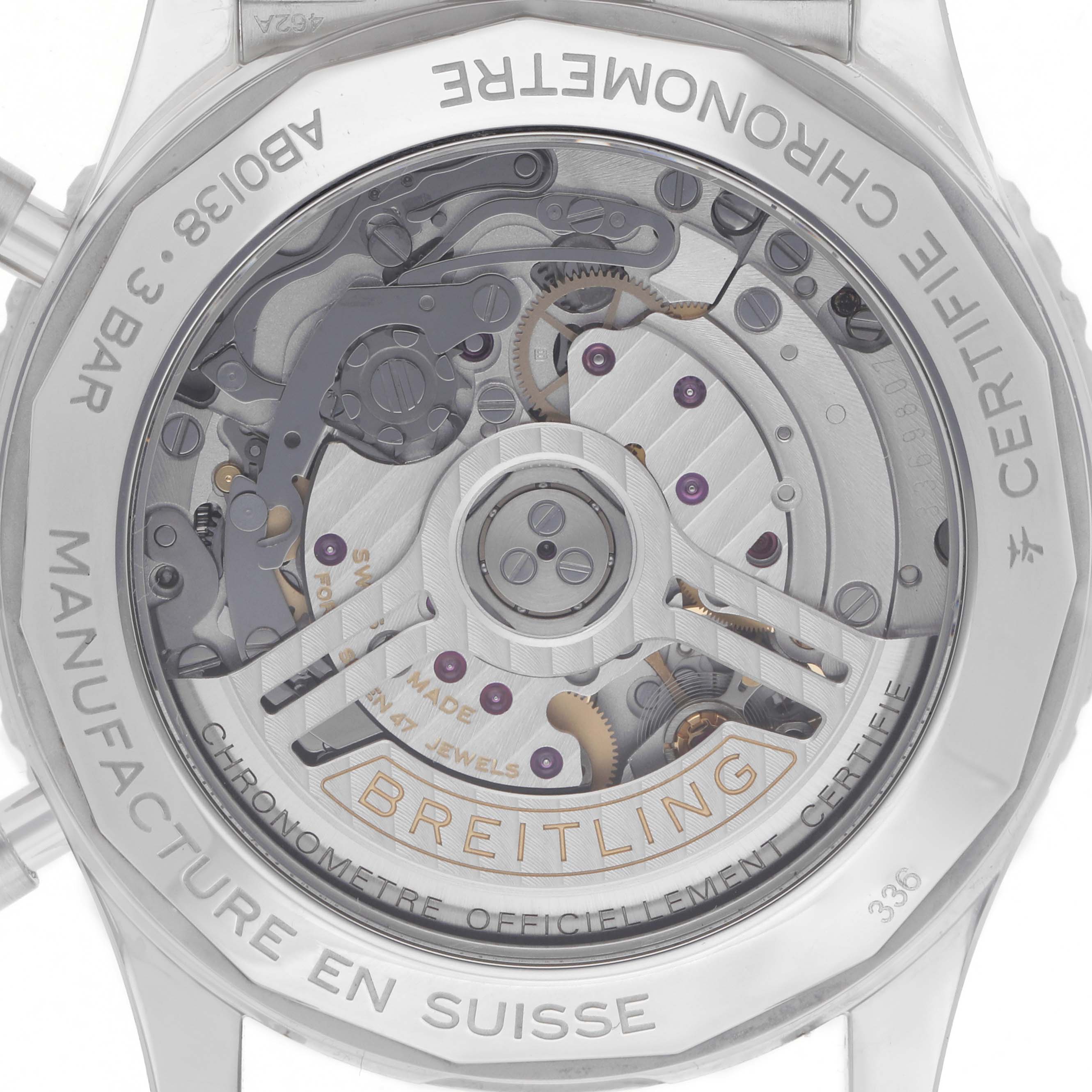 The Breitling Navitimer AB0138 Men
s Stainless Steel Pink Dial watch is shown from the back, showcasing its intricate mechanical movement and rotor.