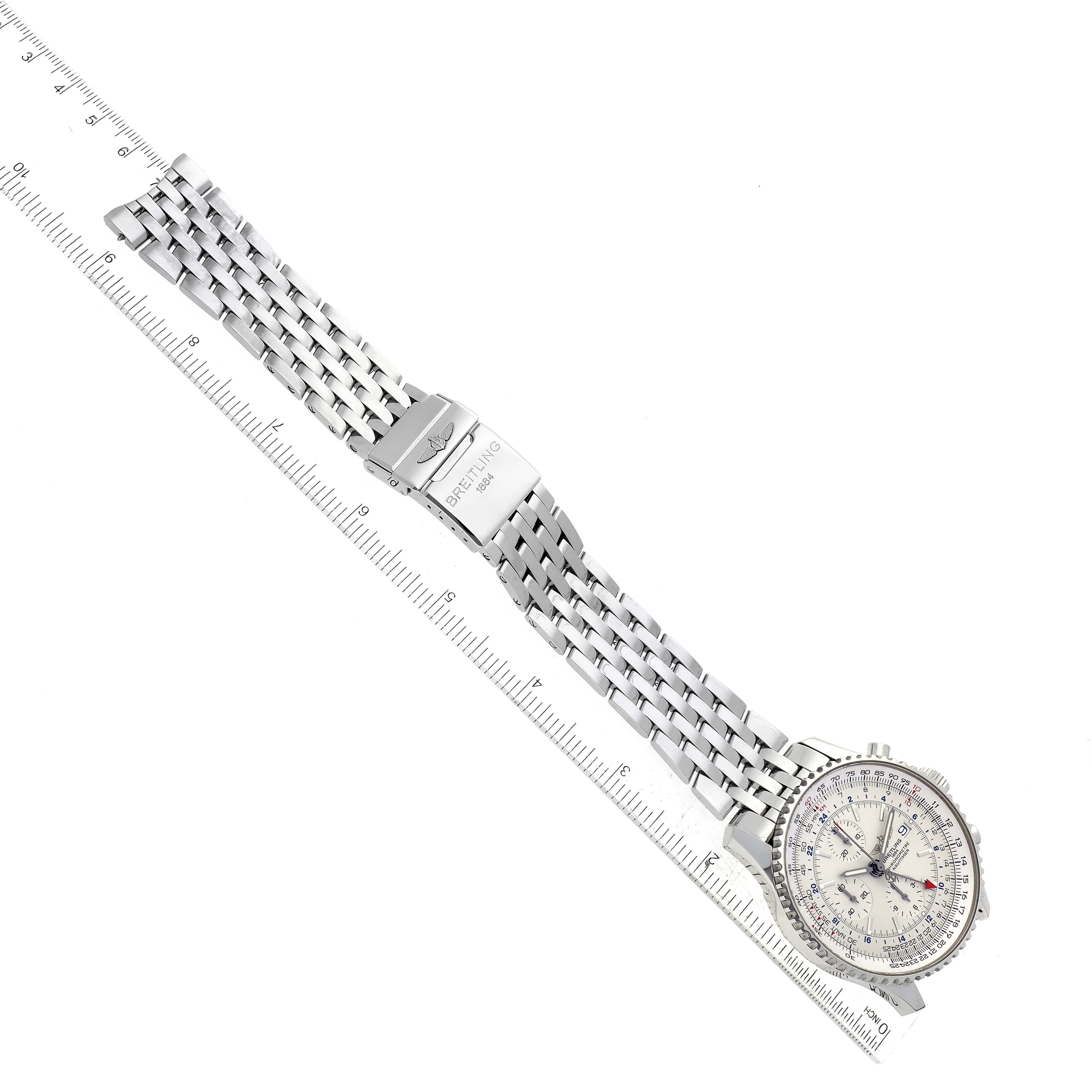 The image shows the Breitling Navitimer A2432212/G571 Men's Stainless Steel White Dial A2432212/G571 Men's Stainless Steel White Dial watch laid flat on a ruler, displaying its face and metal bracelet.