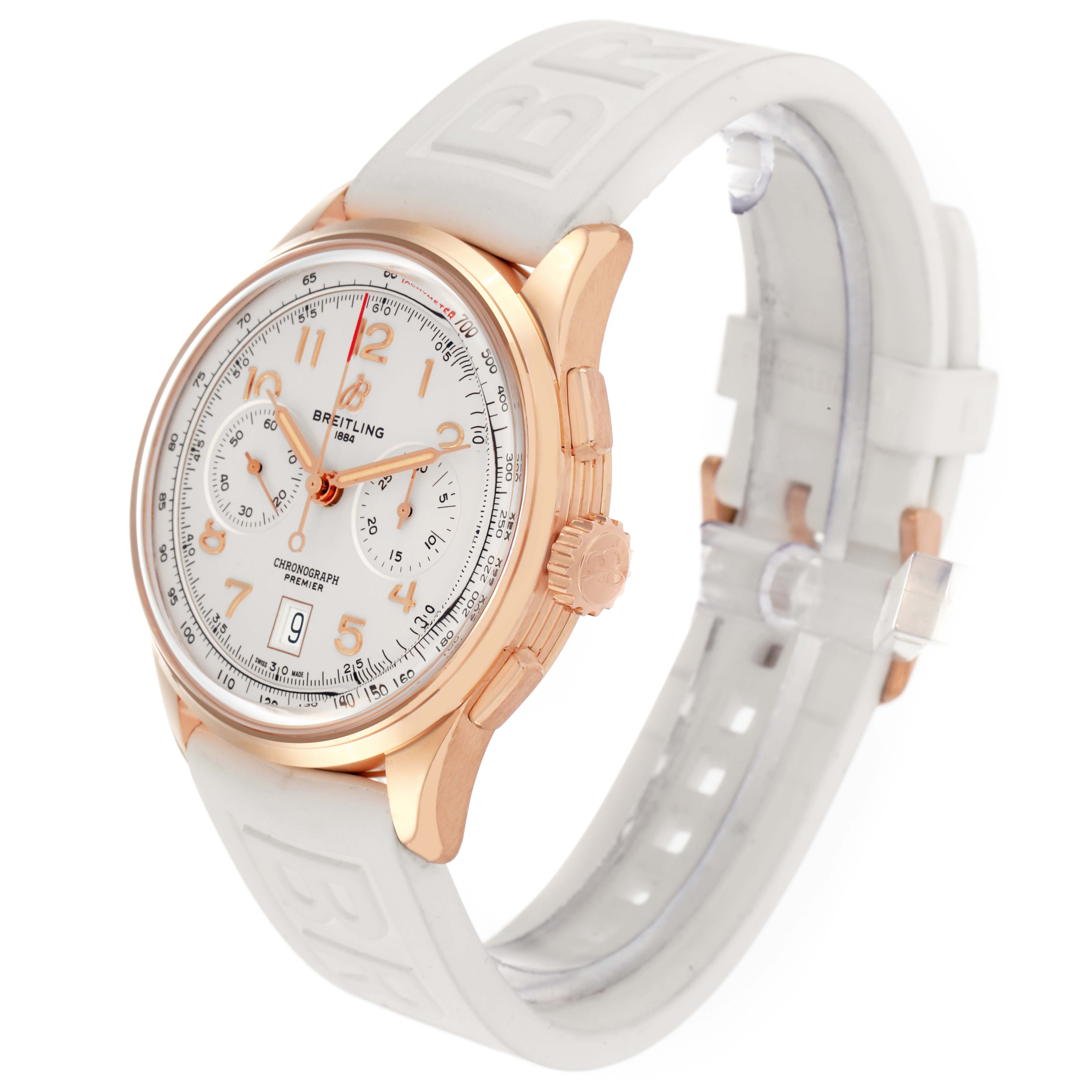 The Breitling Premier RB0145371G1R1 Men
s Rose Gold White Dial model watch is shown from an angled side view, highlighting its face, case, dial, and white strap.