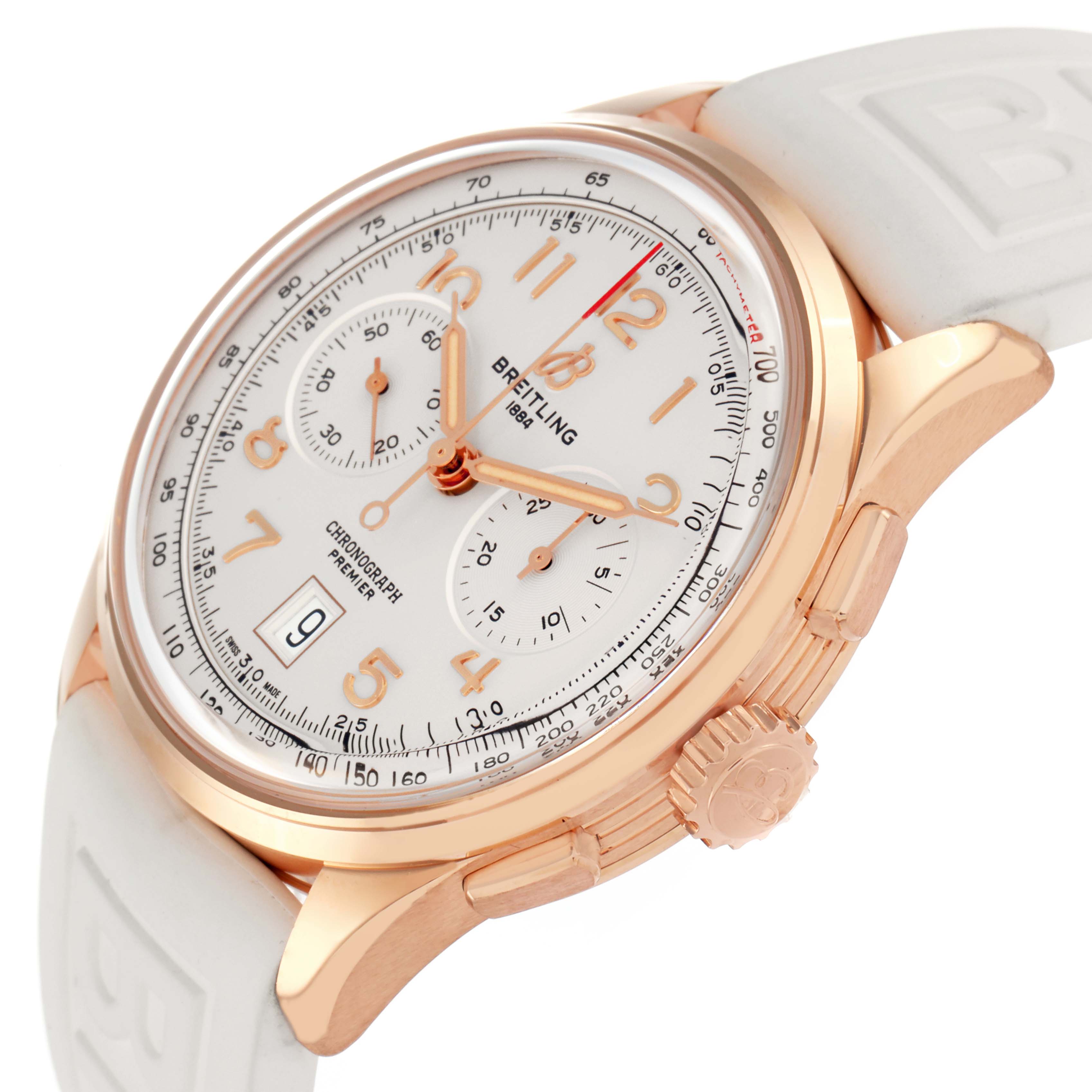 The Breitling Premier RB0145371G1R1 Men
s Rose Gold White Dial watch is shown at an angled view highlighting its dial, gold case, crown, pushers, and white strap.
