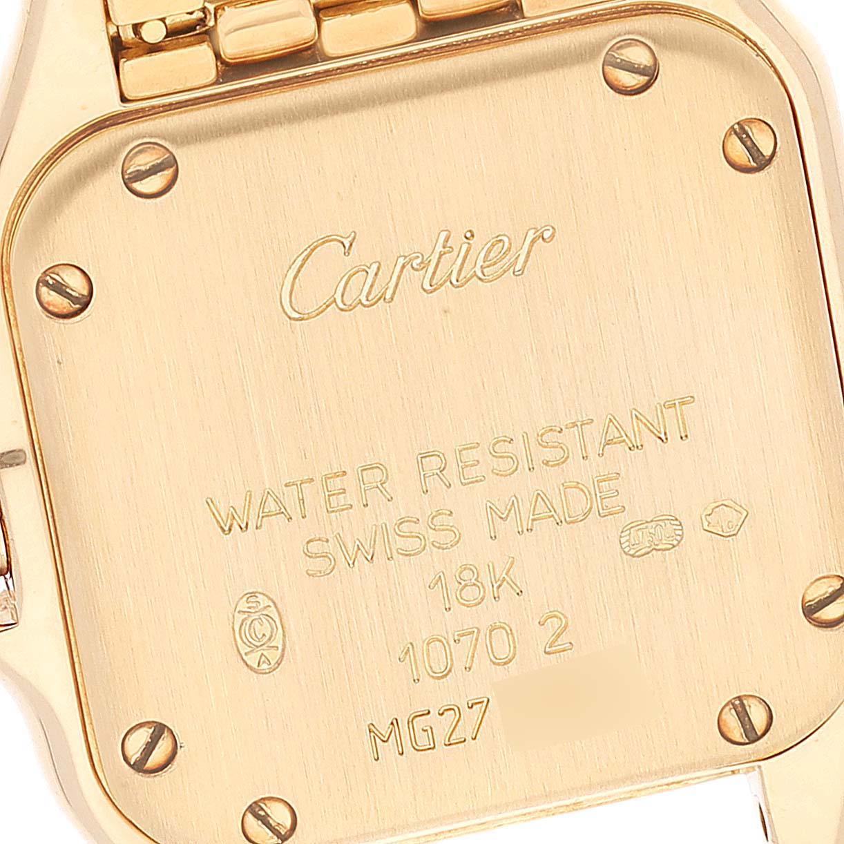 This image shows the back case of a Cartier Panthere 1070 Women's Yellow Gold Silver Dial 1070 Women's Yellow Gold Silver Dial watch, highlighting its markings and screws.