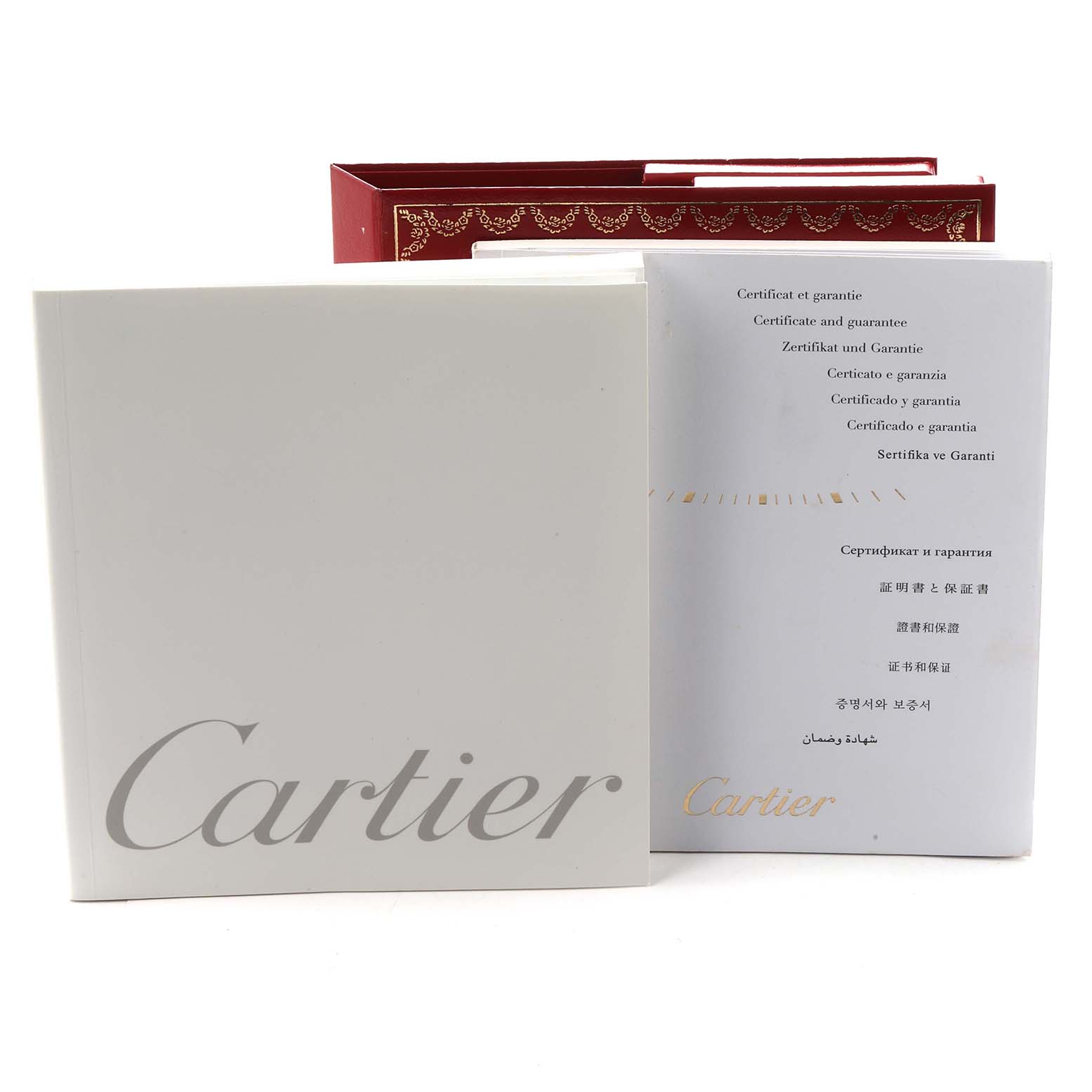 The image shows documentation and a box for the Cartier Roadster W62020X6 Men
s Stainless Steel Black Dial watch, viewed from the front.