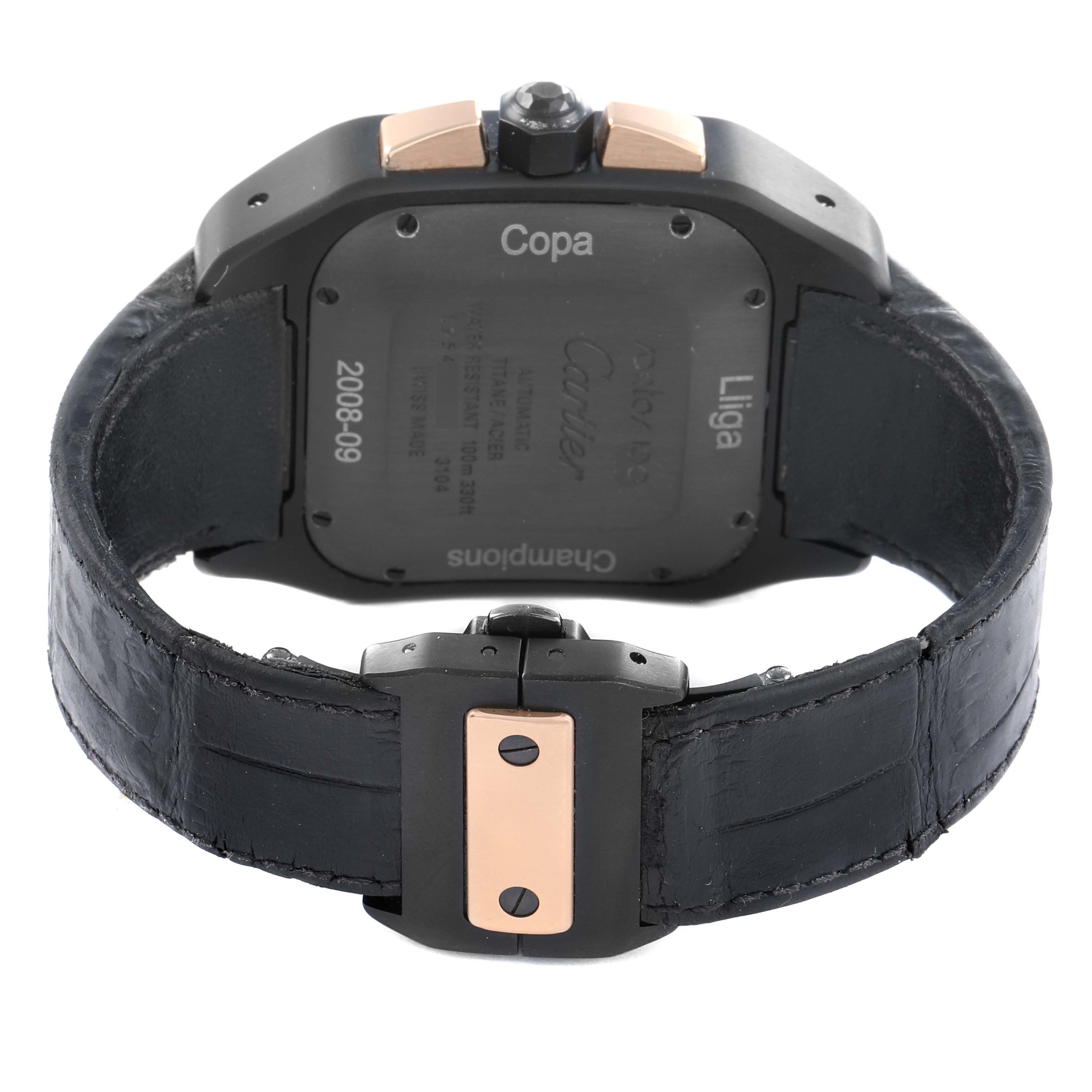 The image shows the back and clasp of a Cartier Santos W2020004 Men
s Titanium Black Dial watch, highlighting the case back and leather strap.