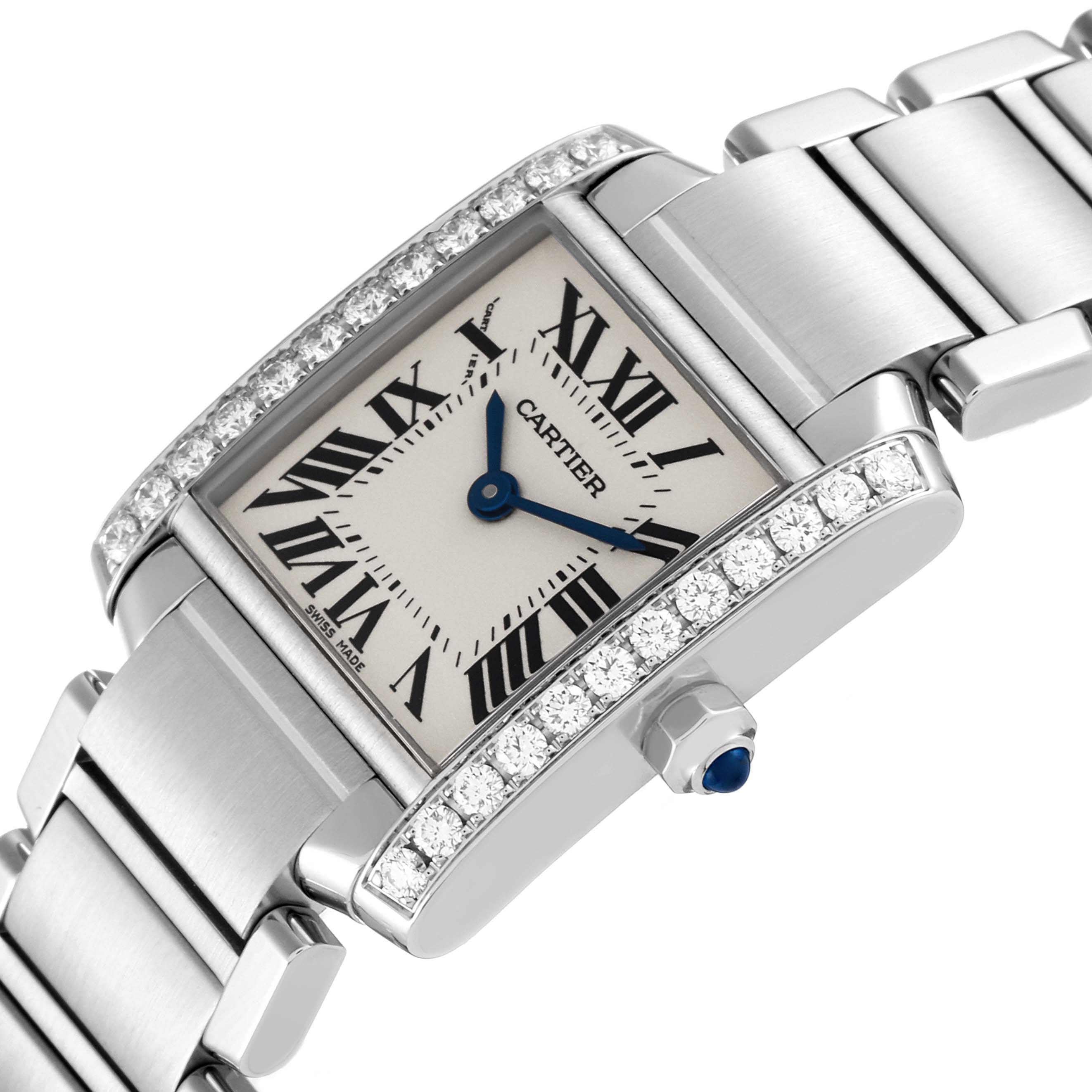 The image shows a Cartier Tank Francaise W4TA0008 Women
s Stainless Steel Silver Dial W4TA0008 Women
s Stainless Steel Silver Dial watch at an angle highlighting its face, bracelet, and jeweled bezel.
