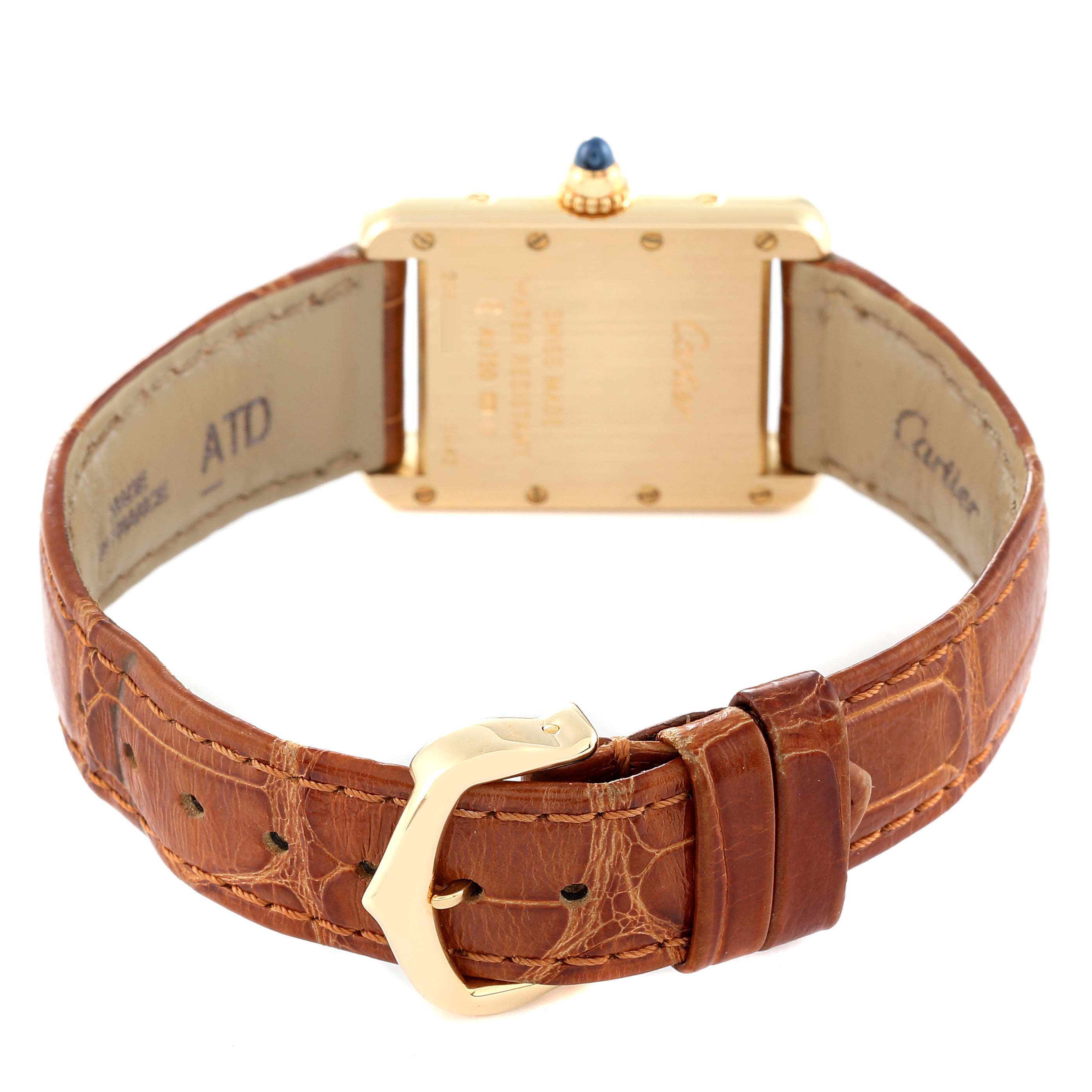 This image shows the back view of the Tank Louis model watch by Cartier, featuring its leather strap and buckle.