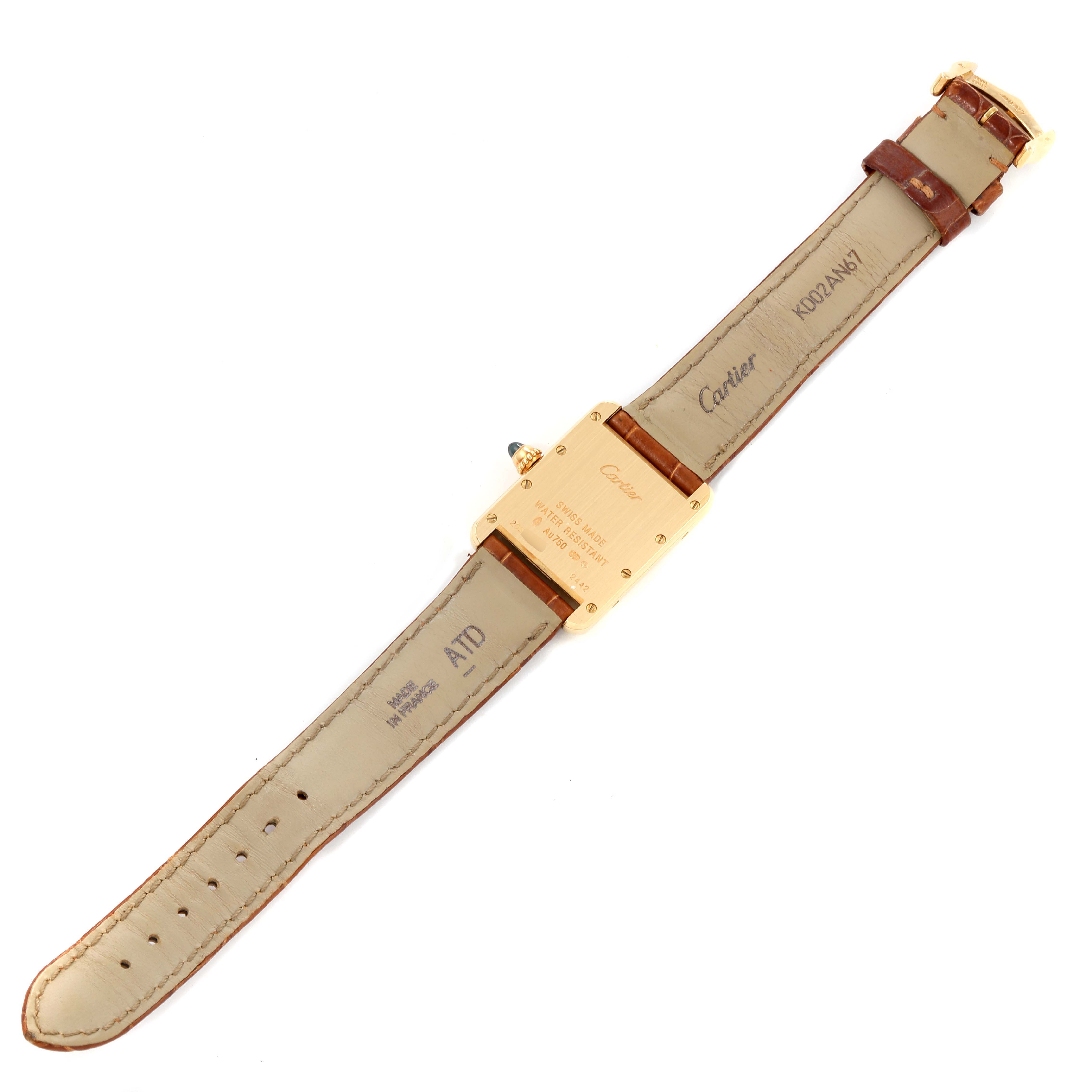 The image shows the back and straps of a Cartier Tank Louis W1529856 Women's Yellow Gold Silver Dial W1529856 Women's Yellow Gold Silver Dial watch laid flat, highlighting the markings and buckle.