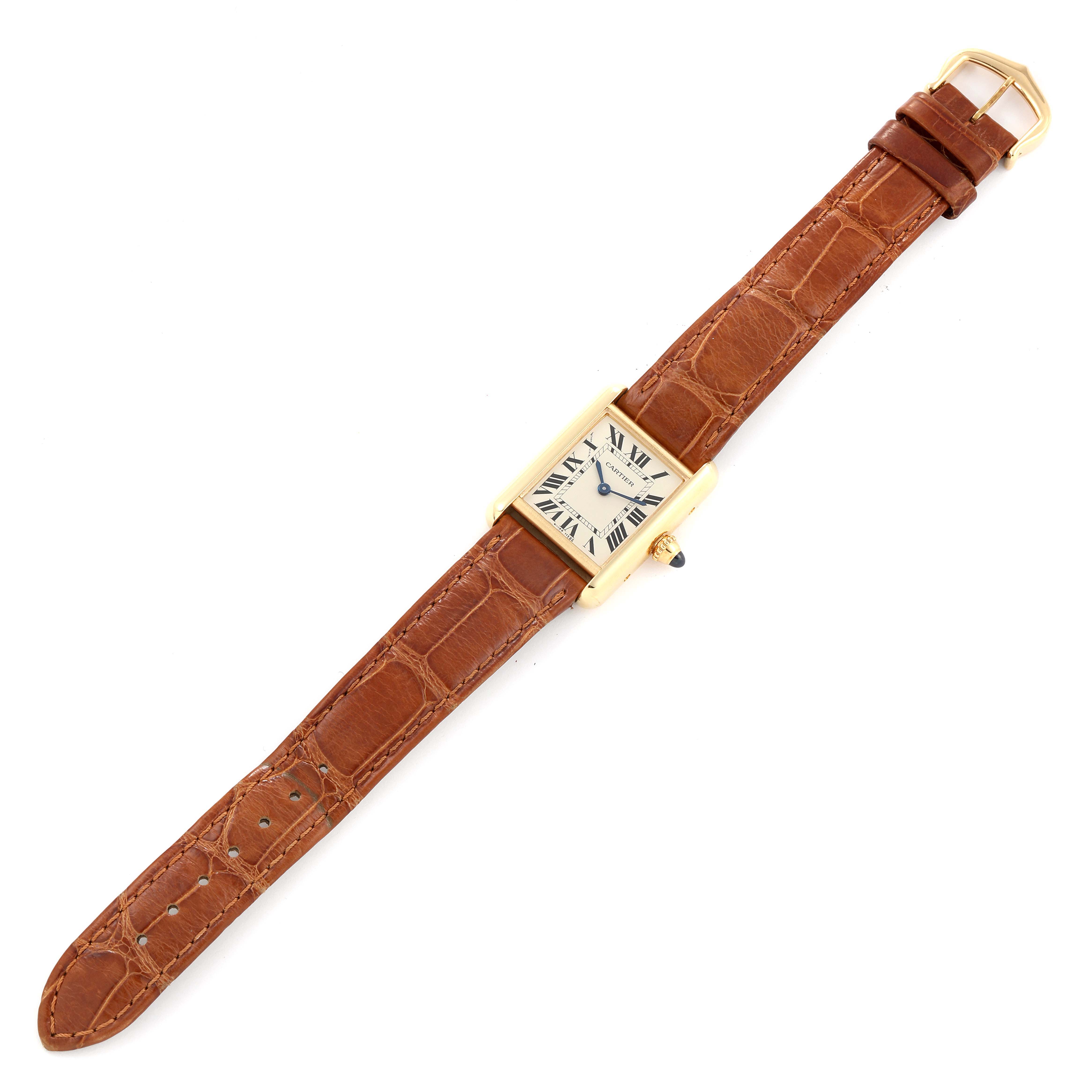 The image shows a Tank Louis watch by Cartier viewed from above, displaying the full strap and watch face.