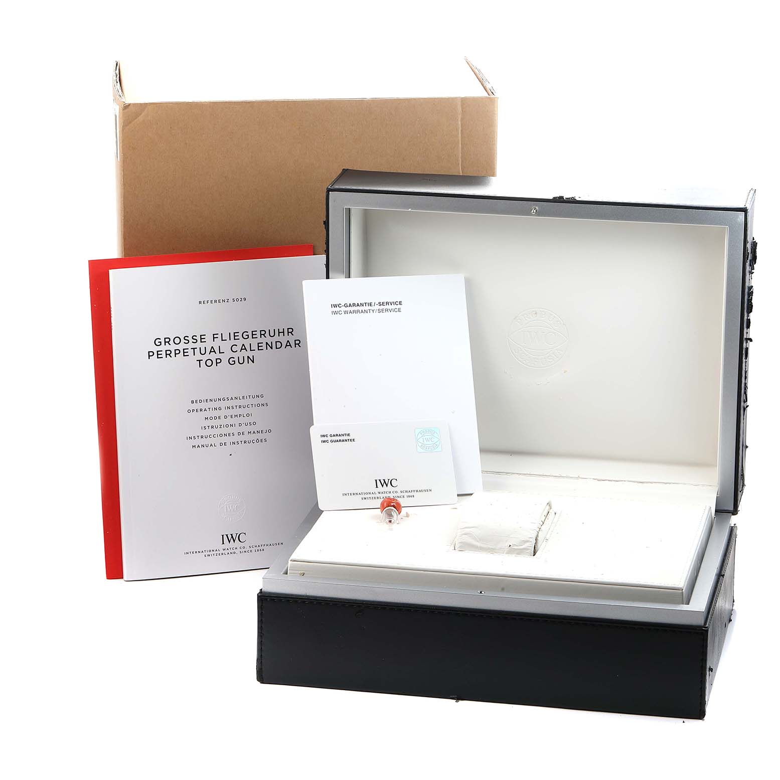 The image shows an IWC Pilot IW502902 Men
s Ceramic Black Dial watch box and accessories, including manuals and a warranty card.