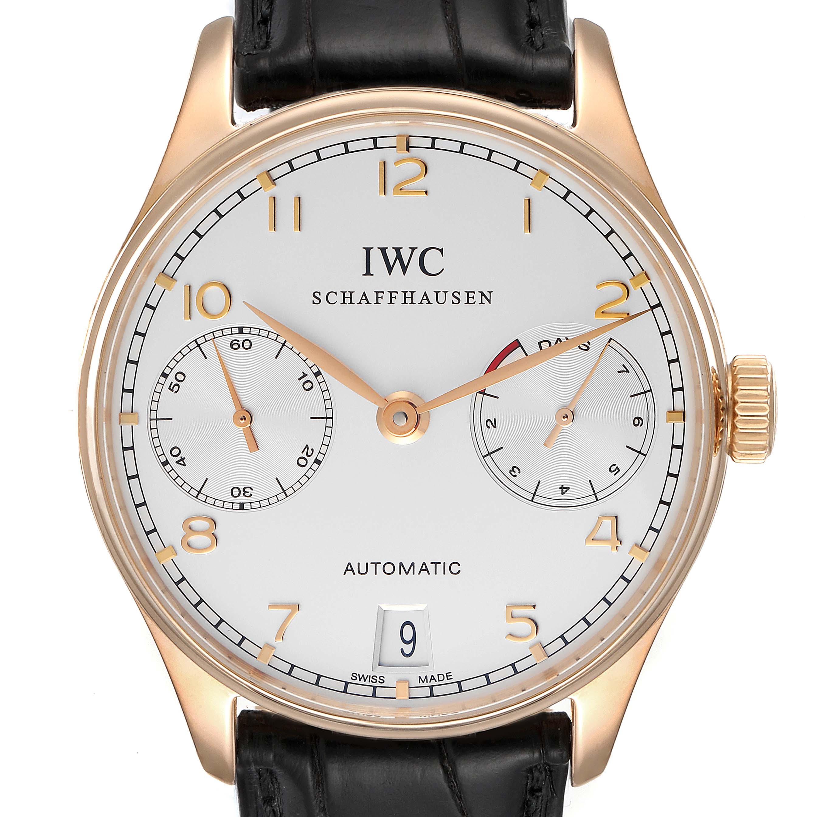 The image shows a front view of an IWC Portuguese IW500004 Men's Rose Gold Silver Dial IW500004 Men's Rose Gold Silver Dial watch, highlighting the dial, hands, subdials, crown, and date window.