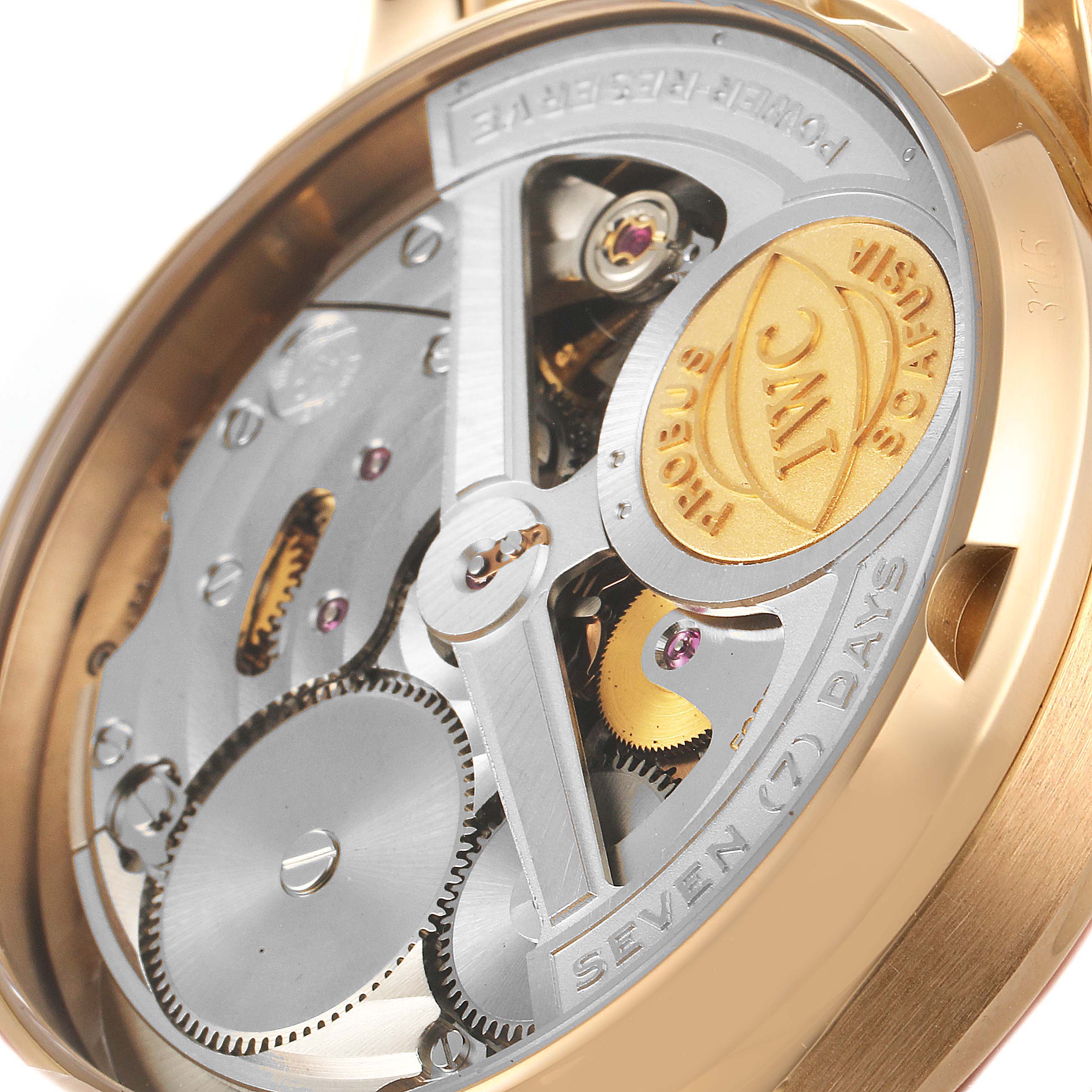 This close-up image shows the open case back of the IWC Portuguese IW500004 Men's Rose Gold Silver Dial IW500004 Men's Rose Gold Silver Dial watch revealing its intricate movement and mechanics.