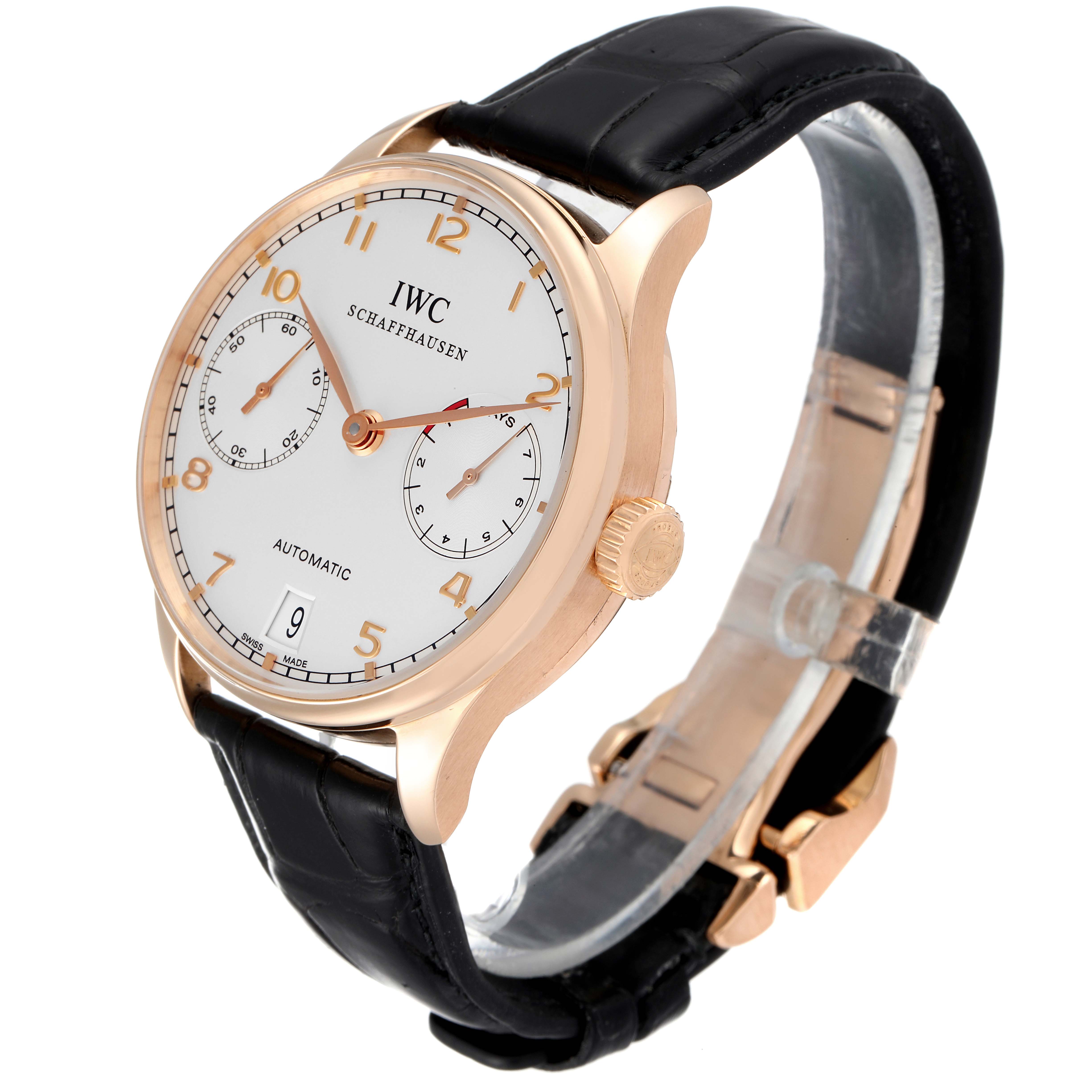 This image shows an angled view of the IWC Portuguese IW500004 Men's Rose Gold Silver Dial IW500004 Men's Rose Gold Silver Dial model watch, highlighting its dial, crown, and black leather strap.