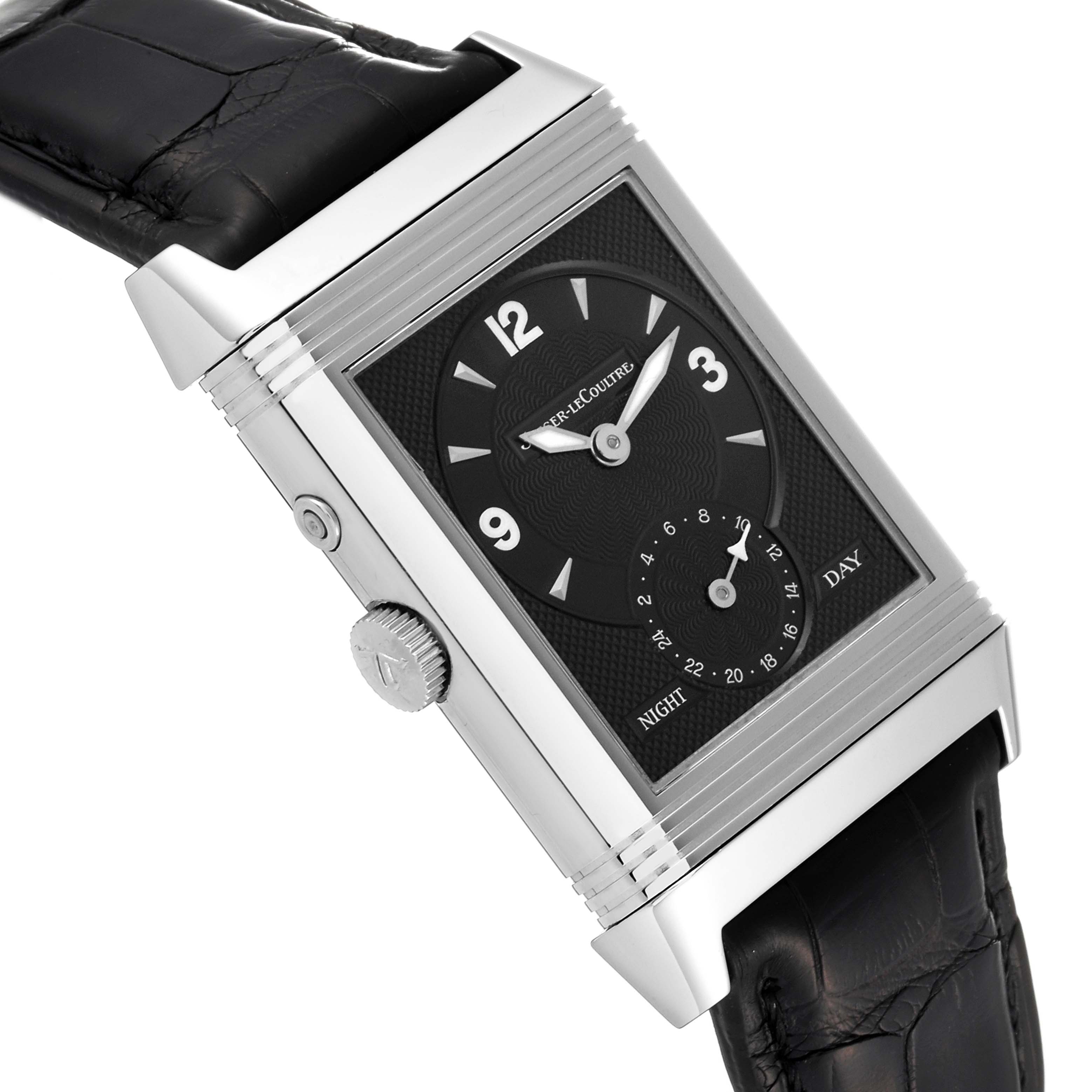 The image shows a Jaeger-LeCoultre Reverso watch at an angled view, highlighting its black dial, side crown, and leather strap.