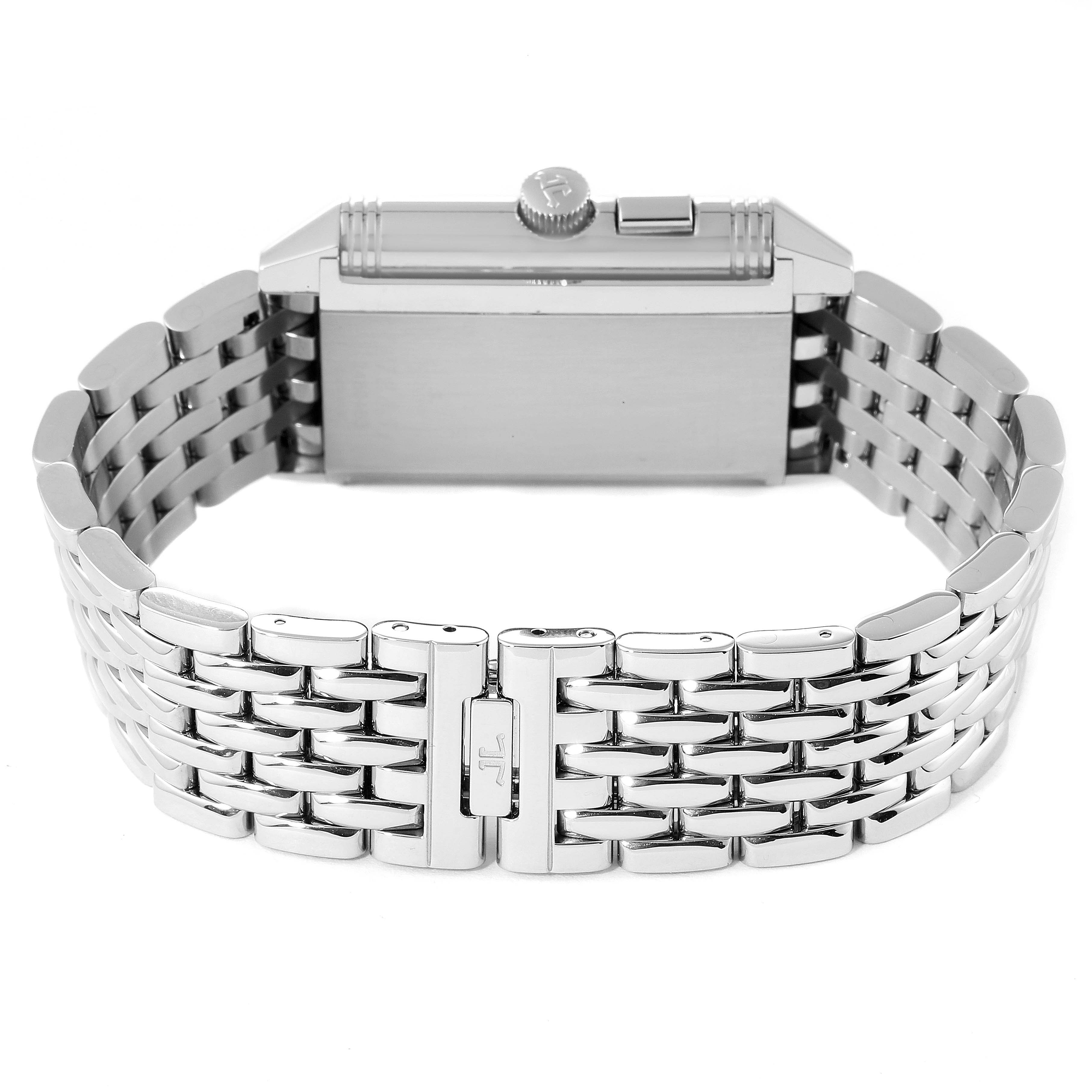 The image shows the back and side crown of a Jaeger-LeCoultre Reverso watch with its metal bracelet.