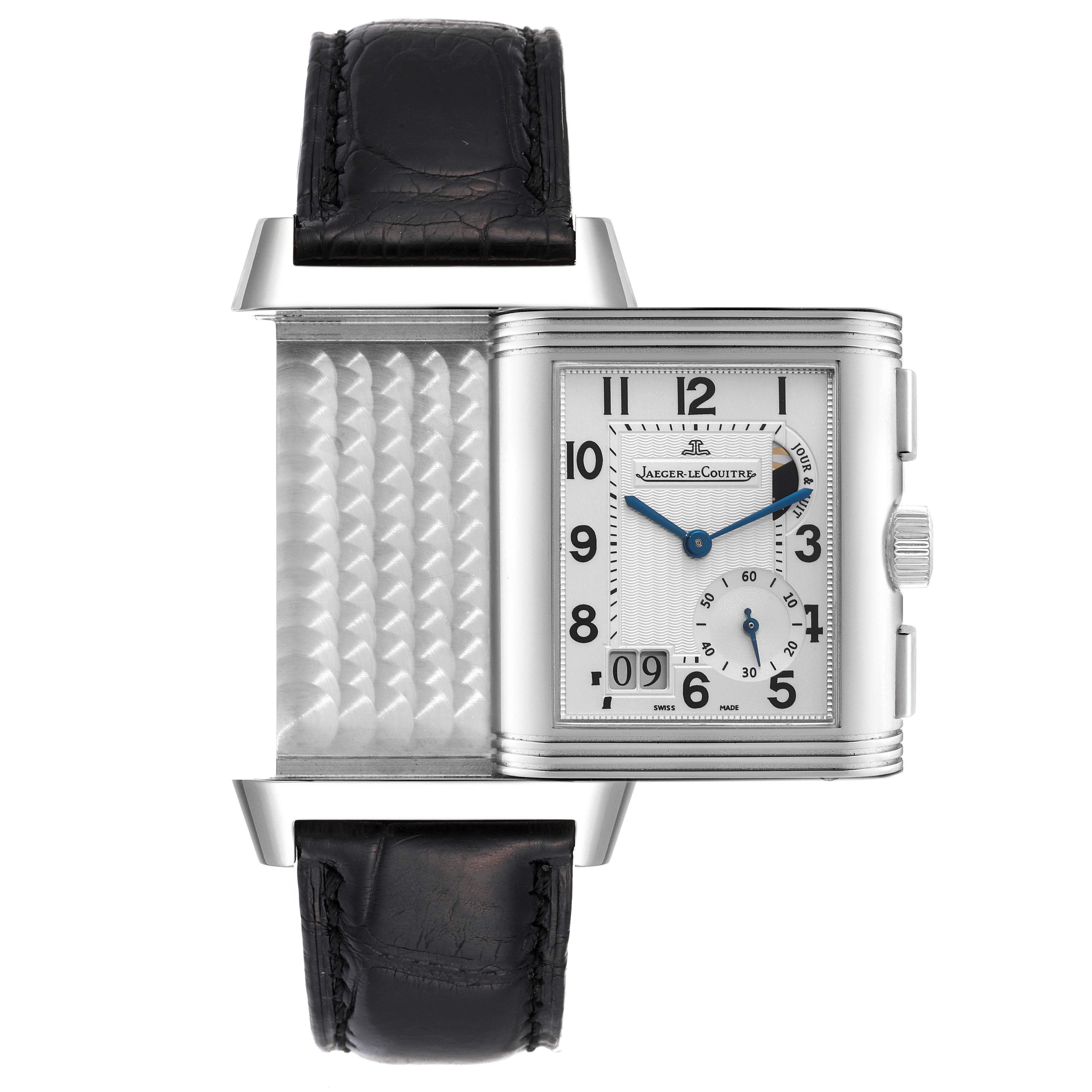 The Jaeger-LeCoultre Reverso watch is shown from a frontal angle, with its case partially rotated to display the reverse side.