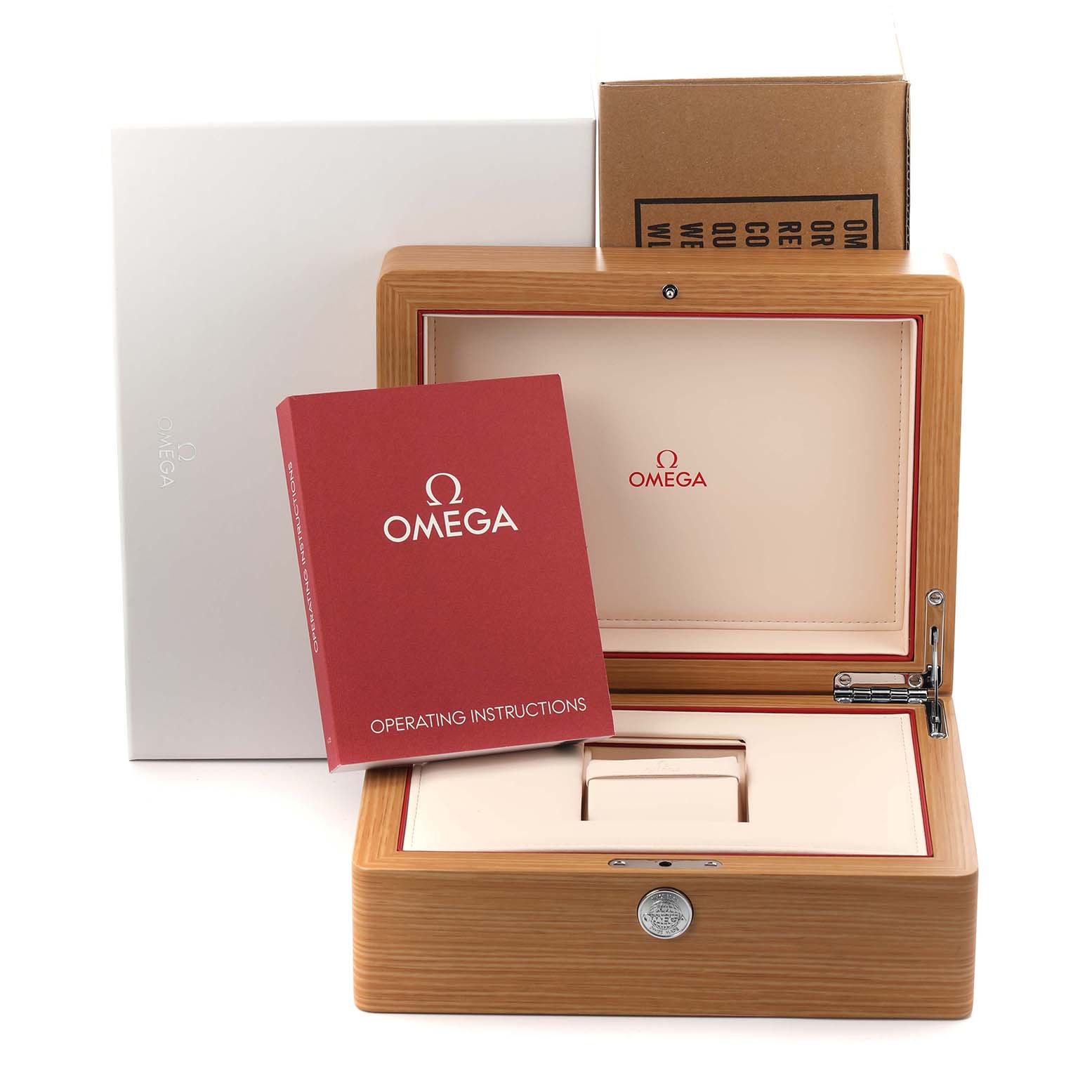 The image shows the packaging and accessories of the Omega De Ville 413.58.37.20.58.001 Men's Yellow Gold Champagne Dial watch, including a wooden box, operating instructions, and outer cover.