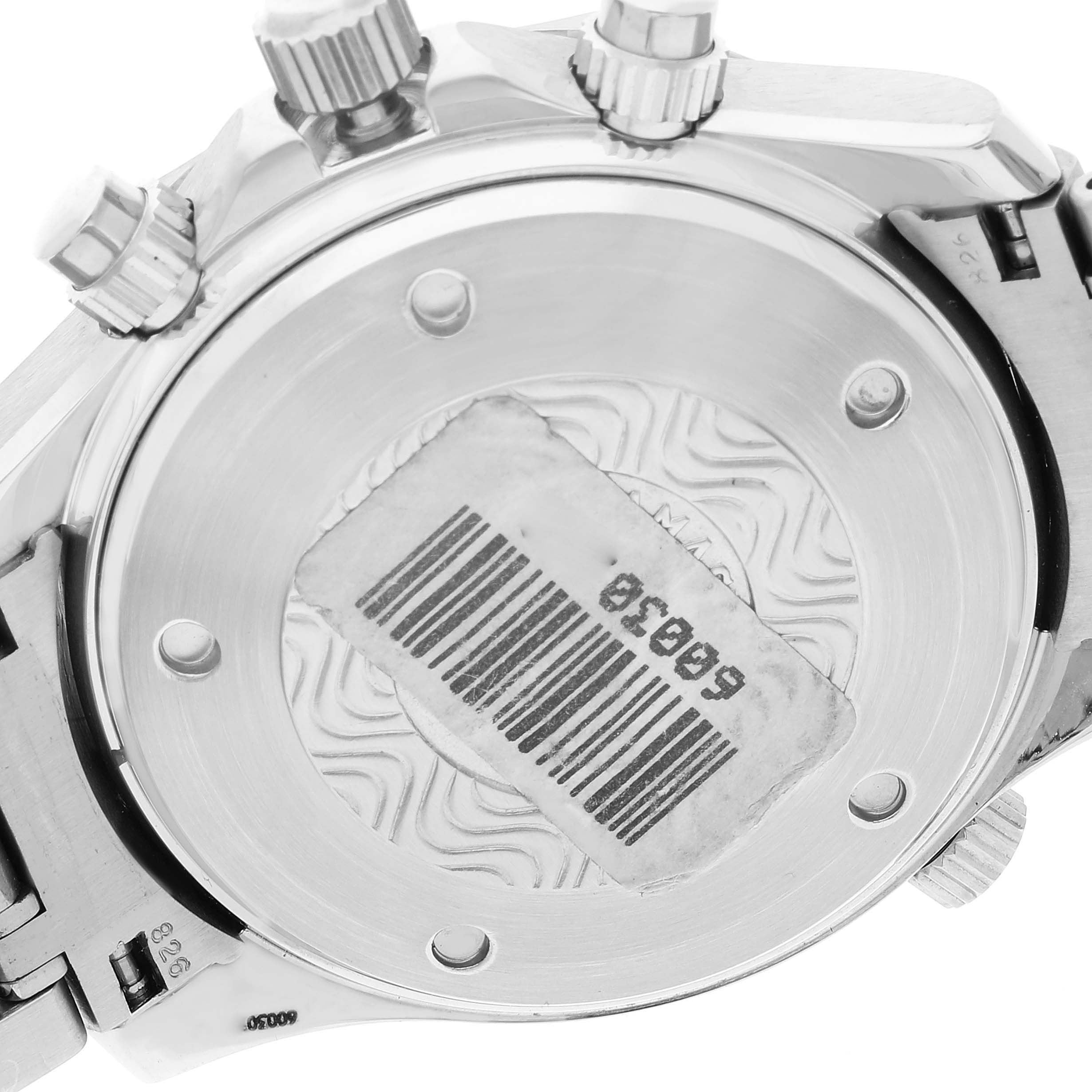 The image shows the back case of an Omega Seamaster 2599.80.00 Men's Stainless Steel Blue Dial 2599.80.00 Men's Stainless Steel Blue Dial watch, including the barcode sticker and the crown side.