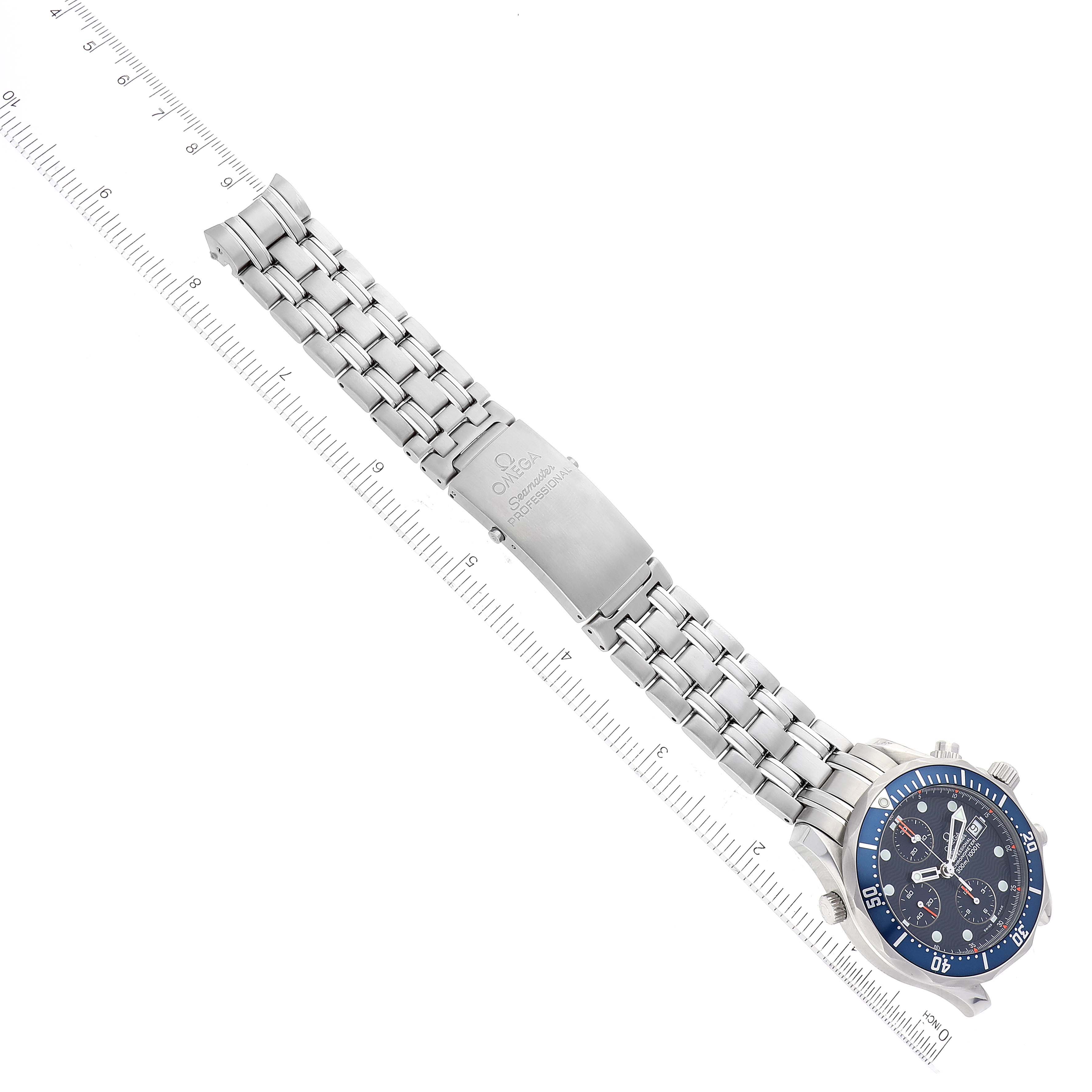 The image shows an Omega Seamaster 2599.80.00 Men
s Stainless Steel Blue Dial 2599.80.00 Men
s Stainless Steel Blue Dial watch laid flat, displaying the face, bezel, bracelet, and clasp, with a ruler for size reference.