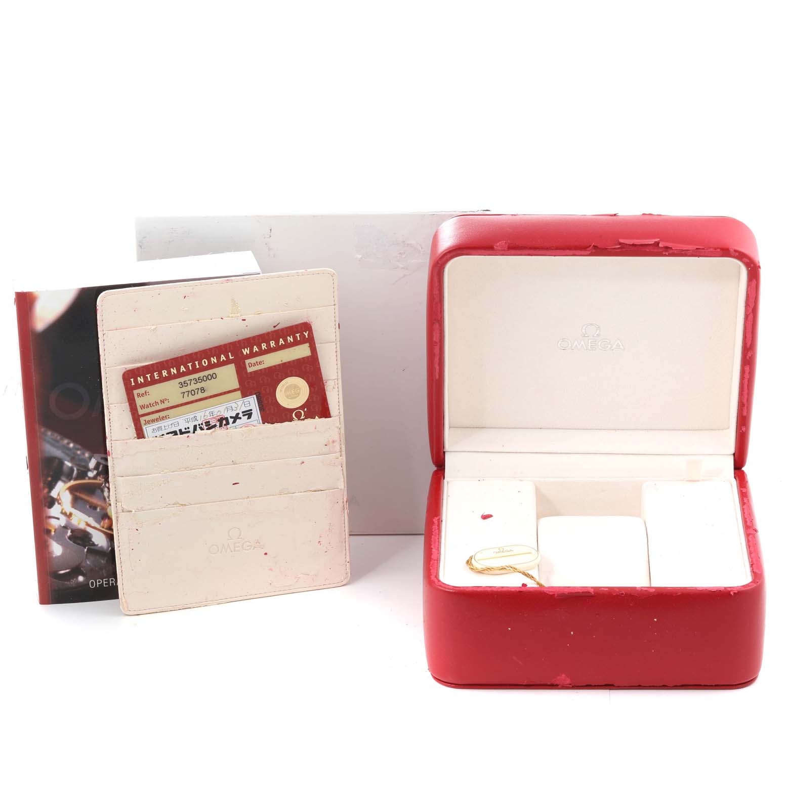 The image shows the Omega Speedmaster 3573.50.00 Men
s Stainless Steel Black Dial 3573.50.00 Men
s Stainless Steel Black Dial watch accessories, including a warranty cardholder, instruction manual, and an empty watch box.