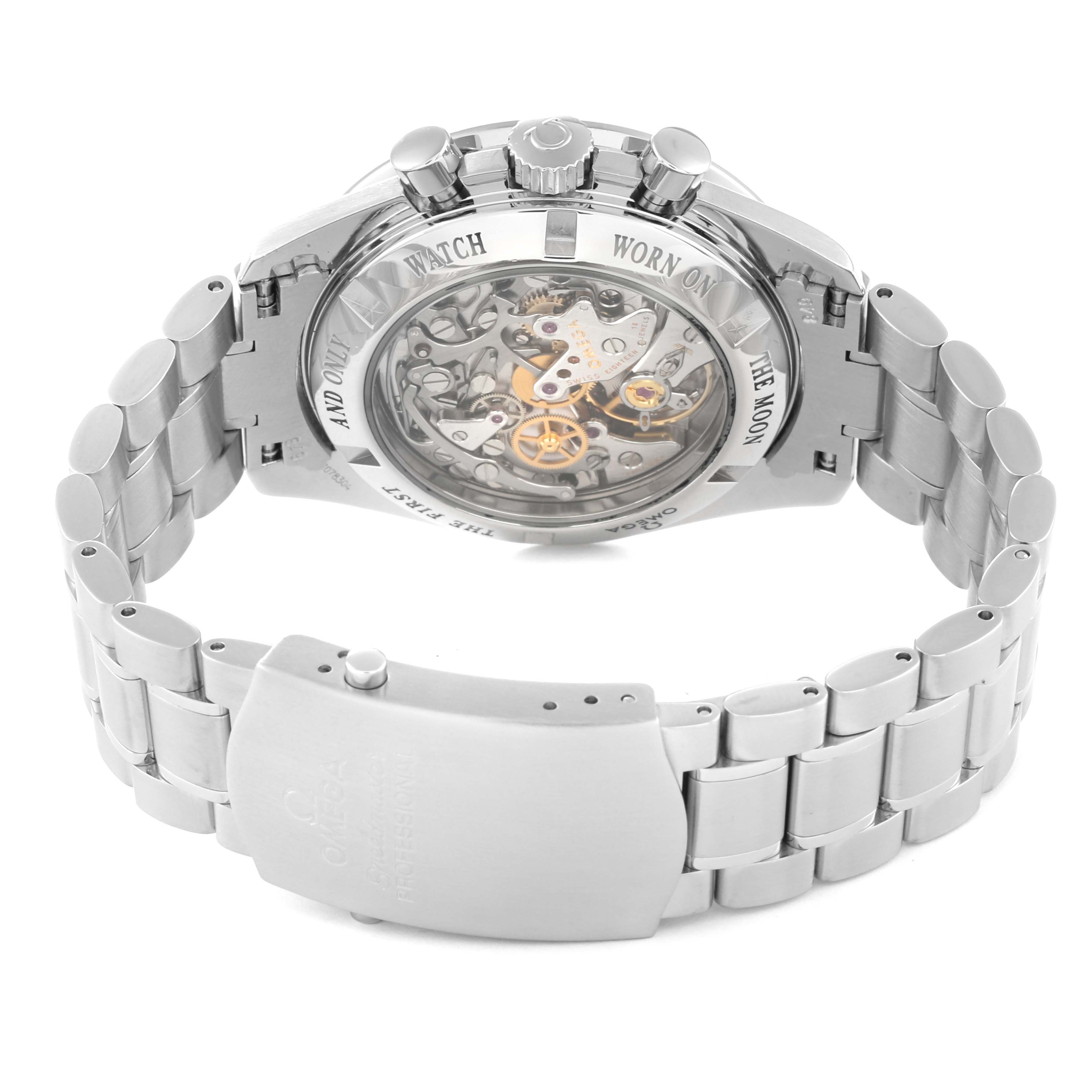 The image shows the back view of the Omega Speedmaster 3573.50.00 Men
s Stainless Steel Black Dial 3573.50.00 Men
s Stainless Steel Black Dial watch, highlighting its open case back and metal bracelet.