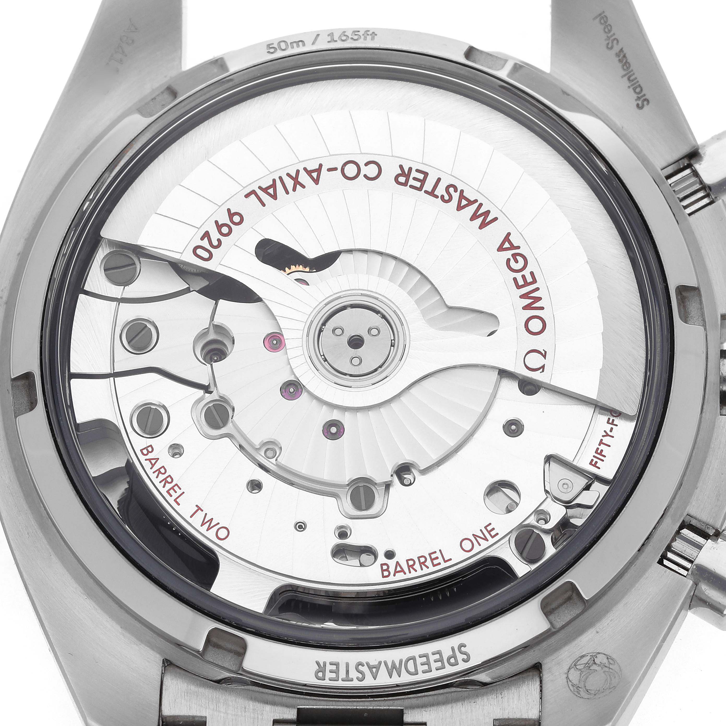 The image shows the movement of an Omega Speedmaster 329.30.44.51.01.003 Men
s Stainless Steel Black Dial watch from the back case, highlighting the Co-Axial 9920 mechanism.