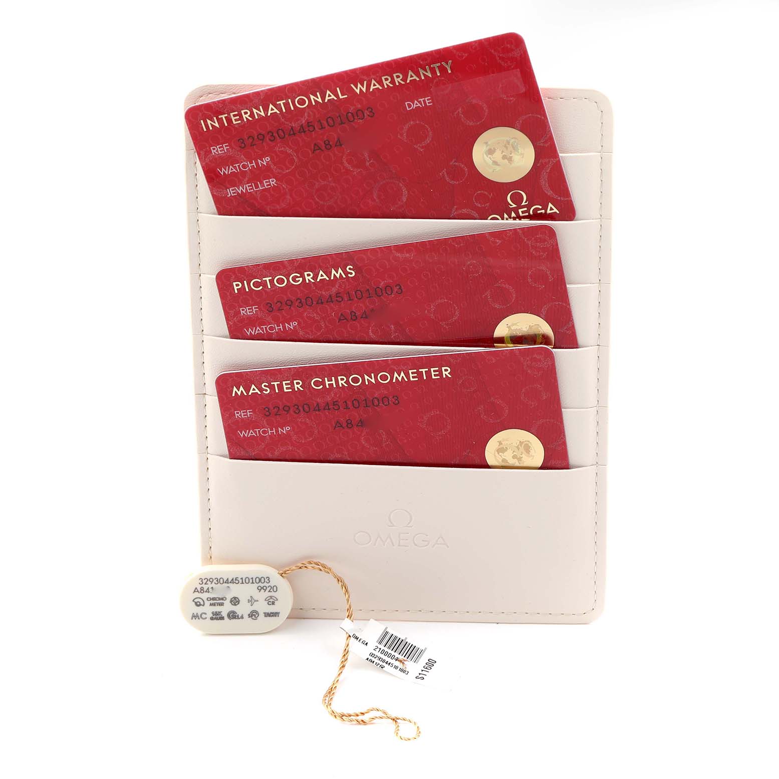 The image displays Omega Speedmaster 329.30.44.51.01.003 Men
s Stainless Steel Black Dial accessories including warranty and chronometer cards, along with a tag and pouch, from a top-down angle.