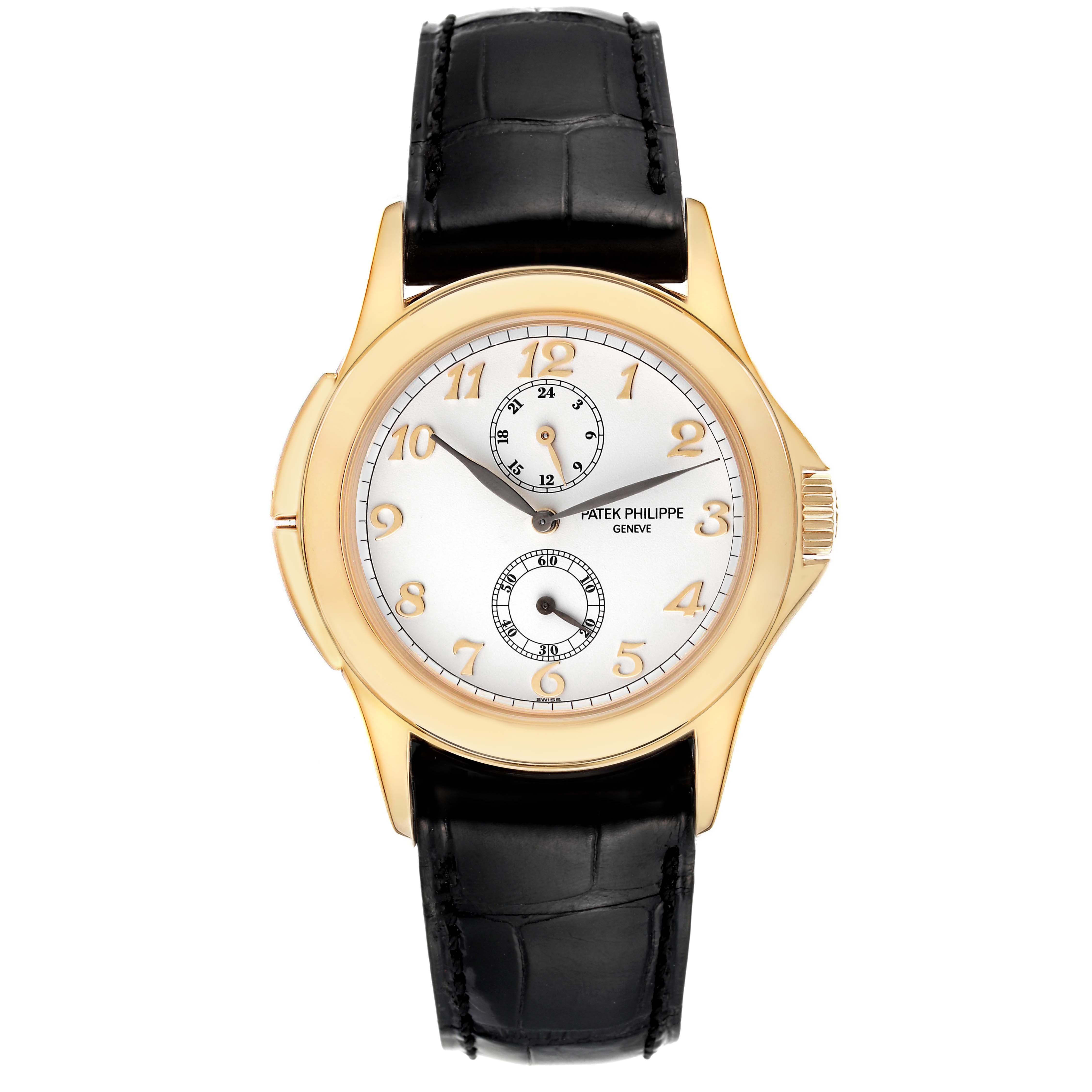 The image shows a front view of a Patek Philippe Calatrava 5134J Men's Yellow Gold White Dial 5134J Men's Yellow Gold White Dial watch with a gold case and black leather strap.