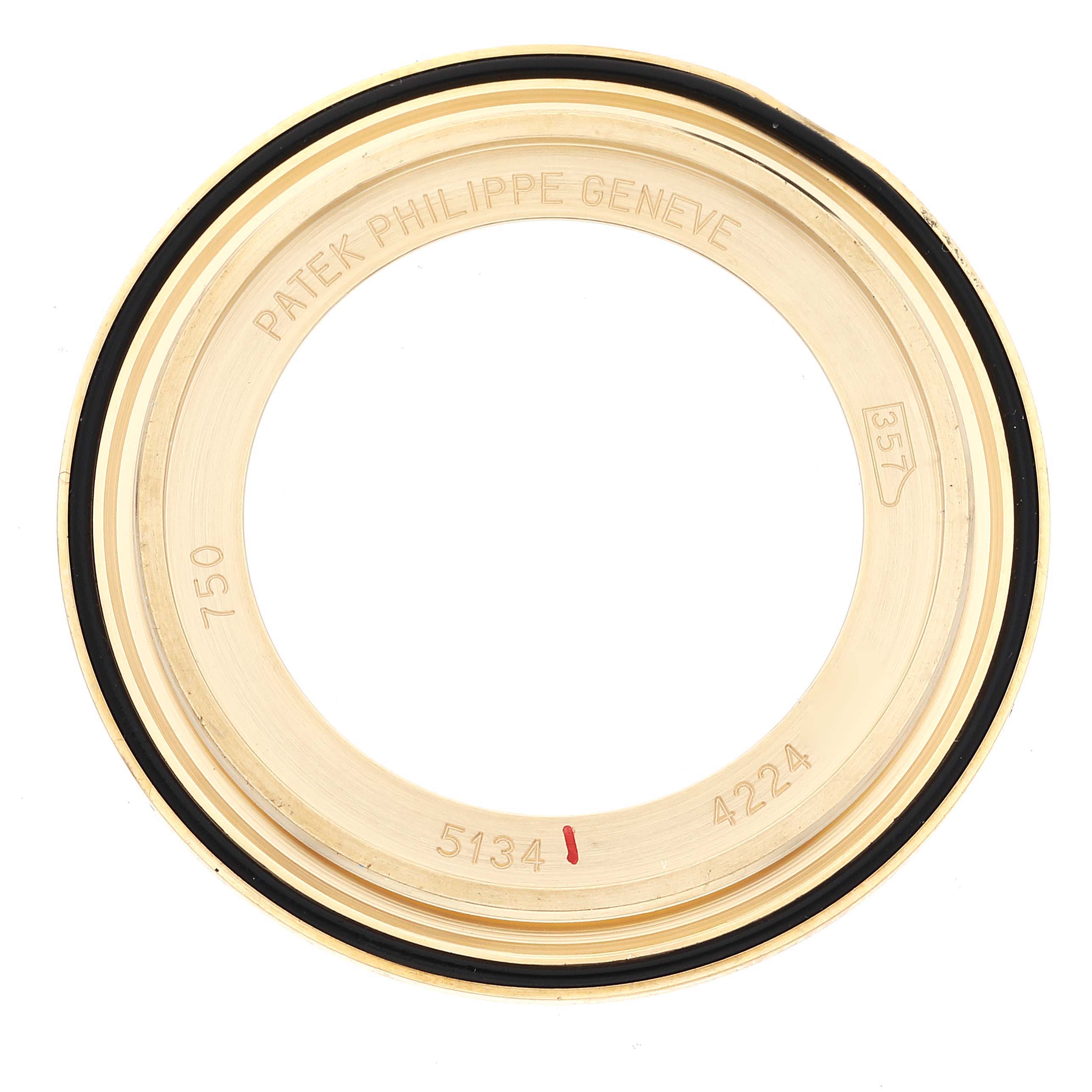 This image shows the bezel of a Patek Philippe Calatrava 5134J Men's Yellow Gold White Dial 5134J Men's Yellow Gold White Dial model watch from a top-down angle.