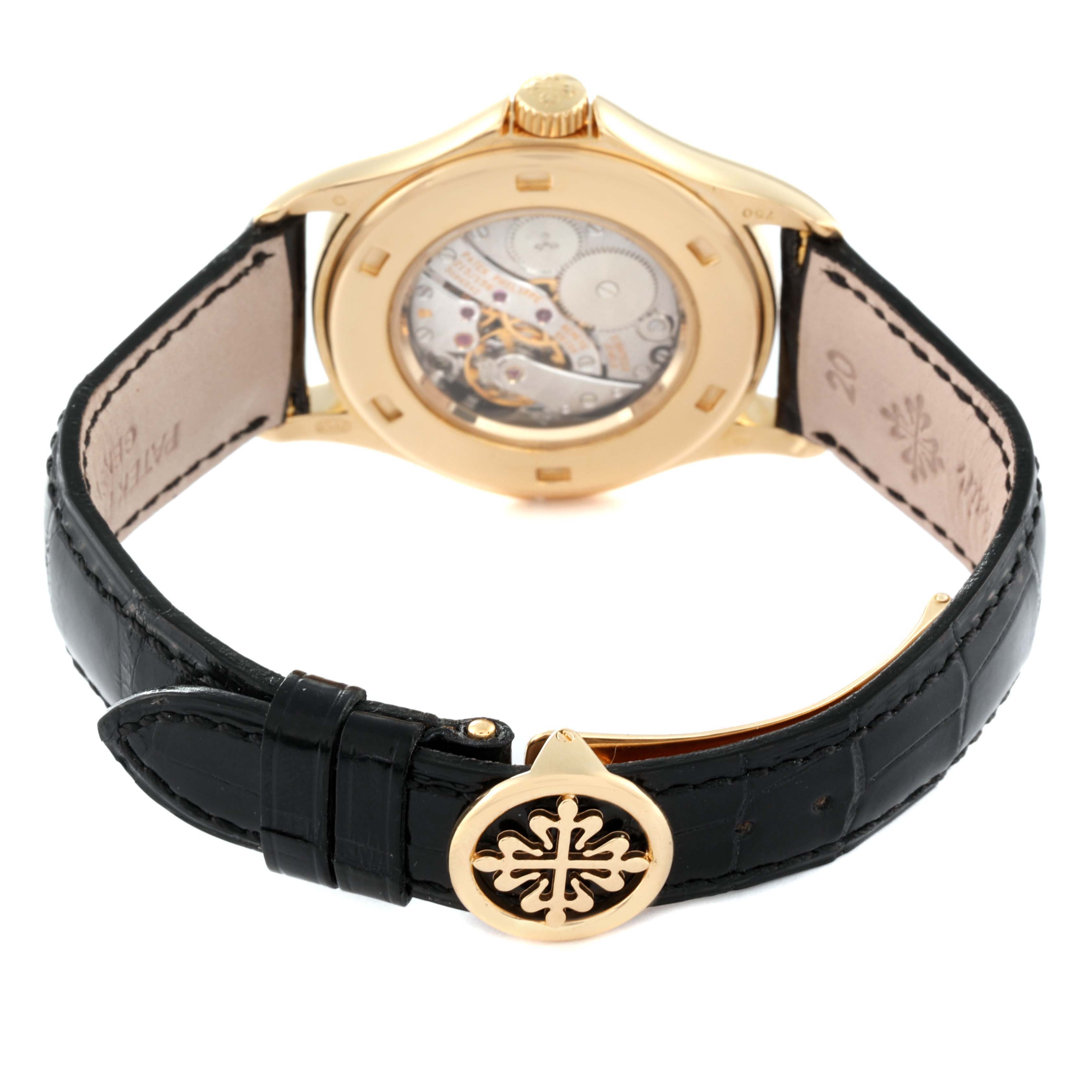 The image shows the back view of a Patek Philippe Calatrava 5134J Men's Yellow Gold White Dial 5134J Men's Yellow Gold White Dial watch, highlighting its transparent case back and black leather strap.