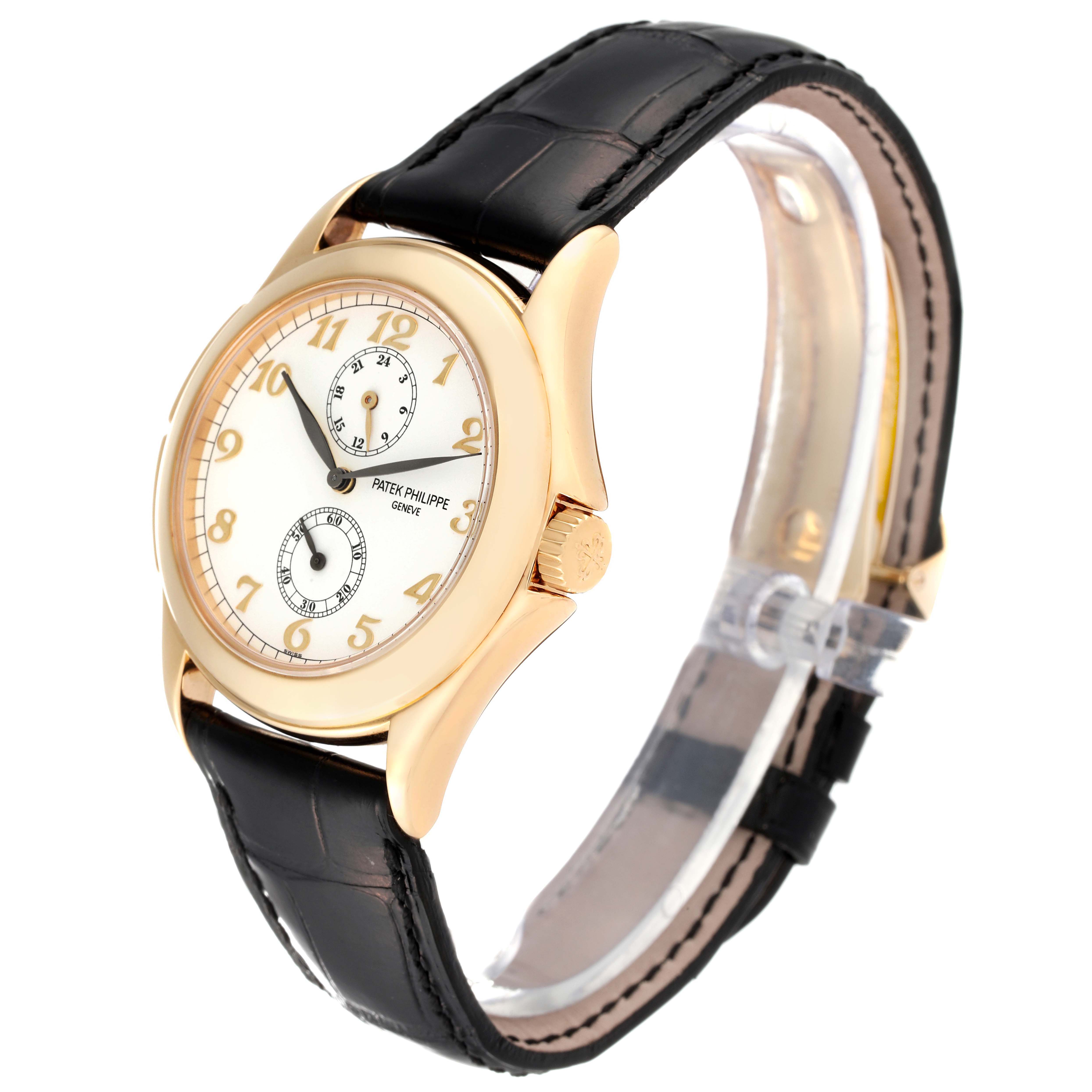 This image shows a side perspective of a Patek Philippe Calatrava 5134J Men's Yellow Gold White Dial 5134J Men's Yellow Gold White Dial watch, highlighting its dial, crown, case, and leather strap.