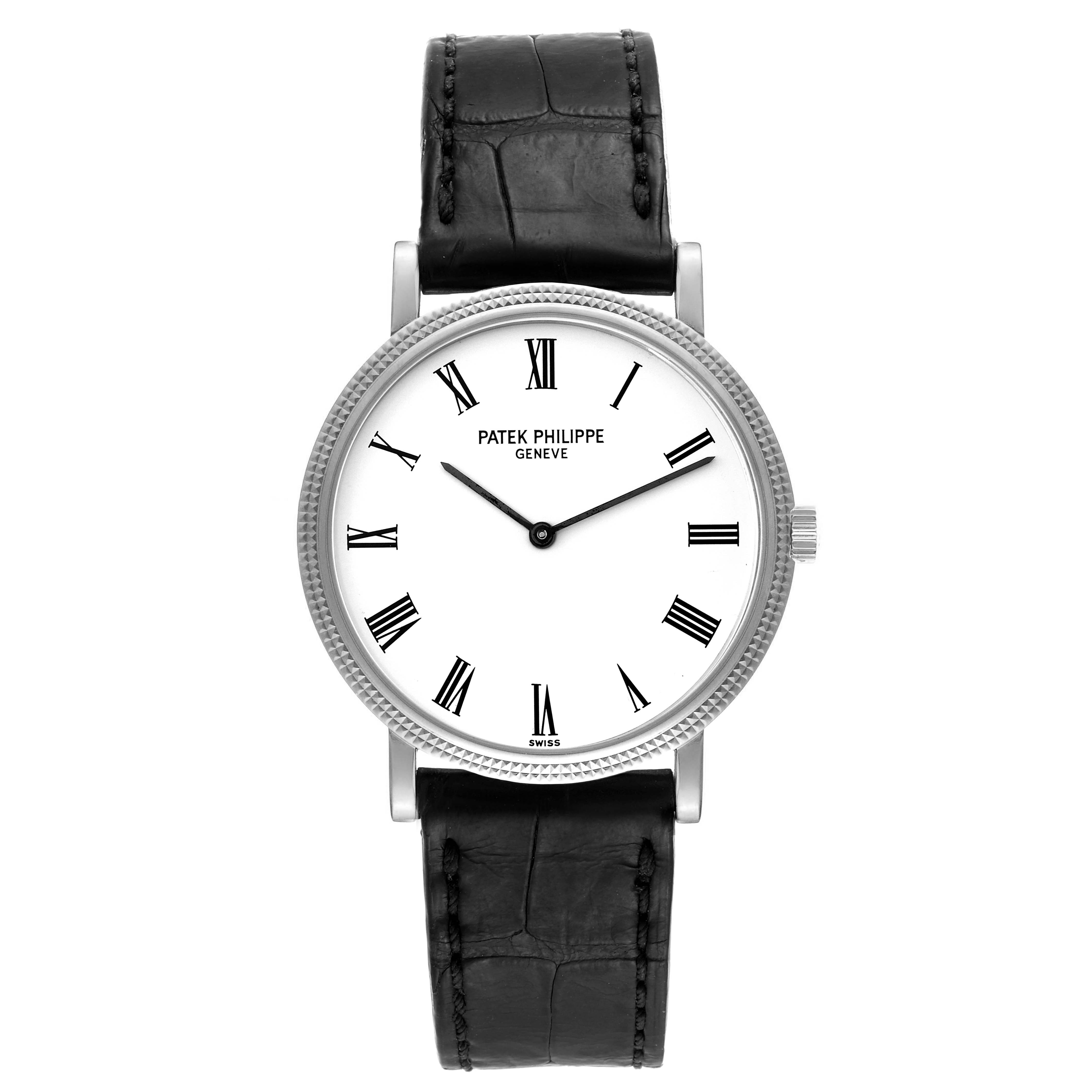 The image shows a front view of a Patek Philippe Calatrava 5120G Men
s White Gold White Dial 5120G Men
s White Gold White Dial watch with a white dial, Roman numerals, and a black leather strap.