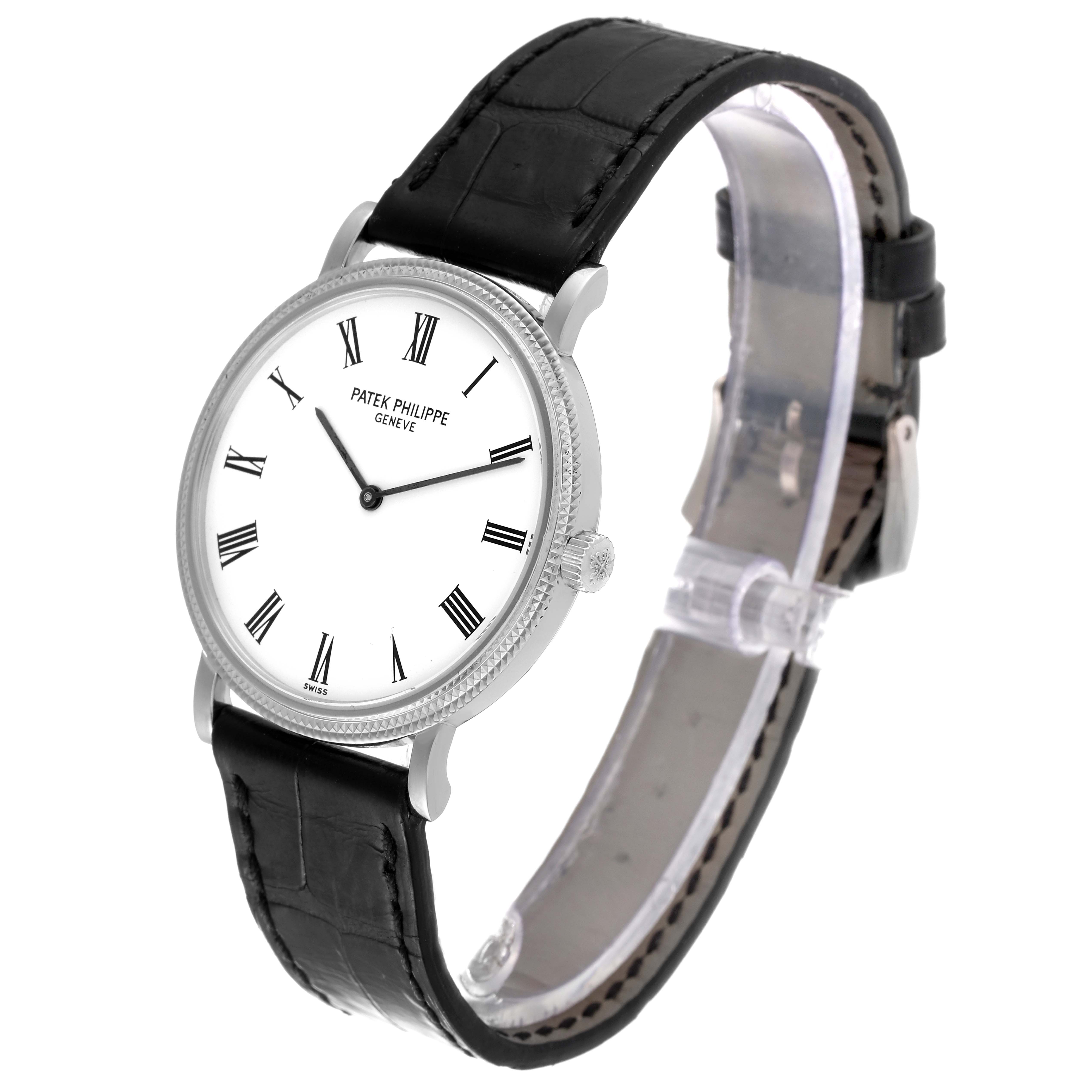 The image shows a side angle of a Patek Philippe Calatrava 5120G Men
s White Gold White Dial 5120G Men
s White Gold White Dial watch, displaying its face, case, and leather strap.